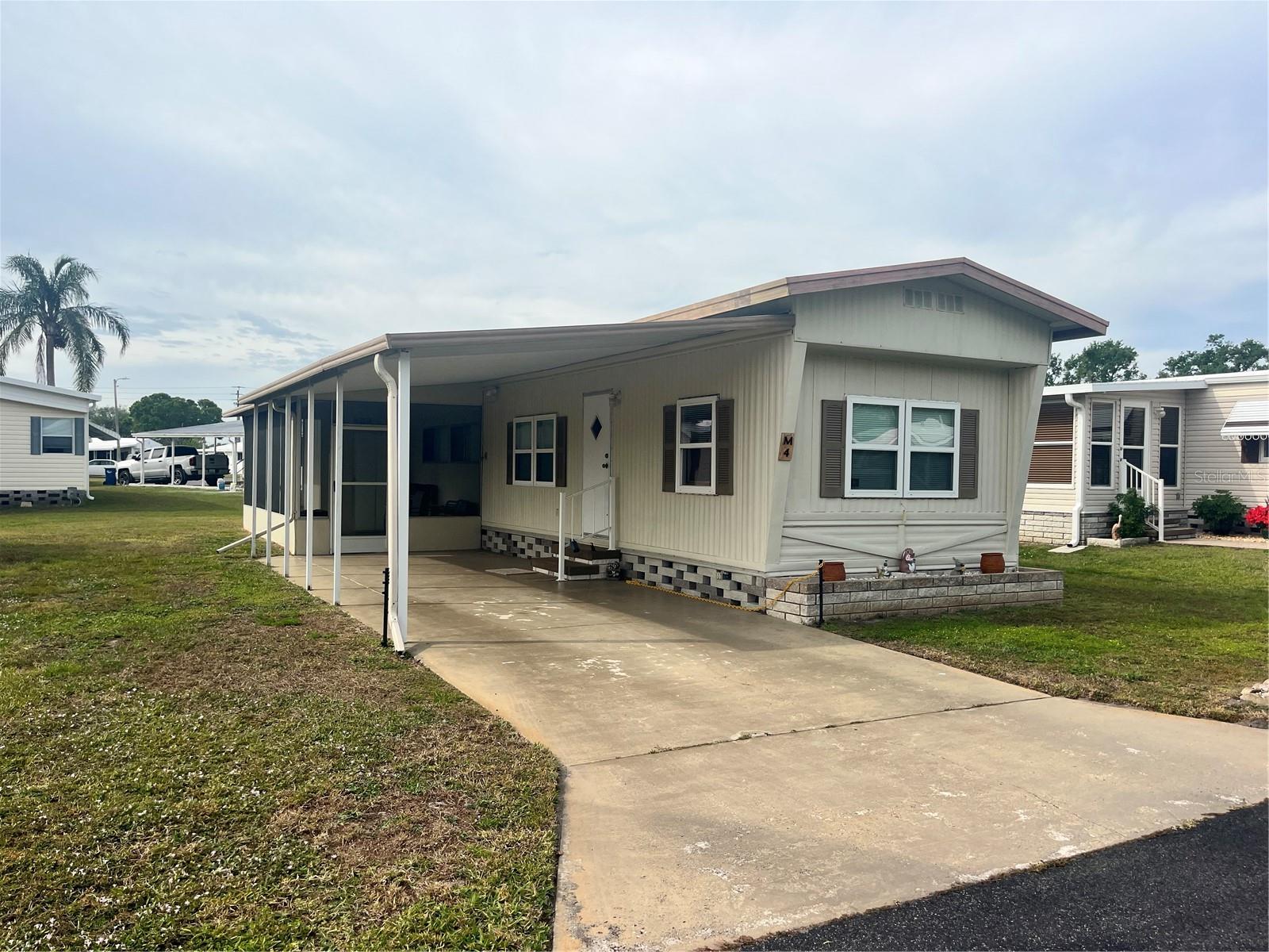 This 2 Bedroom 1 Bath singlewide is in move in condition. All you need to bring are your personal items. Solid laminate flooring through out the home. The current owners have taken very good care of their property and a new owner will reap the benefits. Covered carport and screened lanai. Storage room has the washer and dryer. Westwinds Village is a 55 and over community that has a large clubhouse and community pool. Shuffle board and horse shoe courts. Pool tables and card room for the residents enjoyment. They also have an RV or boat storage area for a extra fee. Yard maintenance gives you more time to enjoy what the community has and your neighbors.