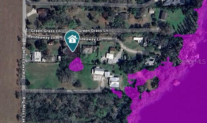 Discover an exceptional opportunity to build your dream home on this 100' x 135' parcel in Pasco County, zoned R-1 for single-family residential development. The property includes 65 feet of deeded access to Moss Lake, a scenic 29-acre motorized lake ideal for boating, fishing, and lakefront relaxation. The .31-acre buildable area sits in Flood Zone X (no flood insurance typically required), while the portion in the SE corner—home to native cypress trees—is located in Zone AE. Whether you're looking to build new, invest, or enjoy a rustic weekend getaway, this unique property offers flexibility, natural beauty, and prime location.