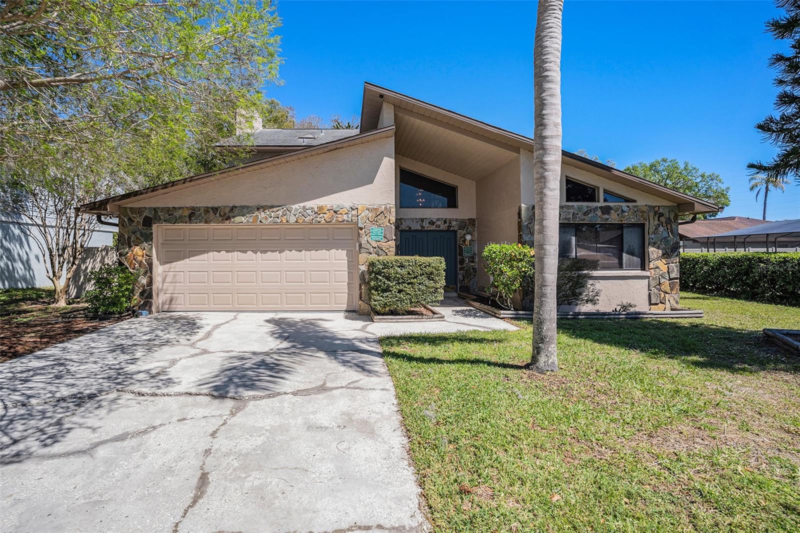 Welcome to your own private retreat in one of Tampa’s most desirable, centrally located neighborhoods. This spacious 4 Bed, 2 1/2 Bath home with a private Pool offers the ideal floorplan for comfortable living and entertaining —including a huge family room with a cozy wood-burning fireplace, a large kitchen, and a separate formal dining and formal living room. Step outside to your own backyard paradise—a large, screened-in private pool overlooking serene pond and conservation views. Relax on the second-floor wood balcony and soak in the peaceful scenery. The fenced yard offers privacy making it perfect for outdoor fun. The home has solid “bones” and awaits your personal updates to make it shine. Recent improvements include a brand-new electrical panel, a roof replaced under permit less than 15 years ago, and a 4-point inspection confirming the great condition of the A/C and plumbing. Enjoy the lifestyle this wonderful community offers—tree-lined streets, a public golf course, scenic nature paths, a nearby YMCA, and a county community and recreation center. Commuting is a breeze with quick access to Dale Mabry Hwy, Veterans Expressway, and I-275. Plus, you’re just minutes from the Carrollwood area’s fantastic dining, shopping, and entertainment.
Don’t miss this opportunity to own a rare gem in an unbeatable location!