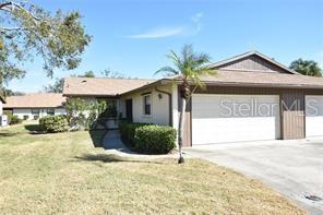 This little piece of paradise is centrally located and ready for you to call home. Nestled among the stately oaks and lush foliage of Village Oaks is a beautifully updated villa with many great features. New A/C (2023) new stainless appliances, all new kitchen cabinets and counter tops (2023) new luxury vinyl flooring, updated baths, new roofs (2019) and a new garage door. The living room has vaulted ceilings which adds to the spacious felling/. The master bedroom features a large walk-in closet, the master bath has a double vanity and large garden tub while the guest bedroom has an equally big walk-in closet. A laundry closet with side-by-side washer and dryer is conveniently located in the hallway across from the kitchen. Easy entry to the Villa from the attached 2 car garage is through the front screened porch. The lanai has been enclosed and features beautiful, tiled floors and Plenty of windows to let in the sunshine. Village Oaks is a great community offering a beautiful setting for it's lakeside pool, tennis courts and pickleball courts. Just minutes away from downtown Sarasota, the UTC Mall, Benderson Rowing facility and many options for dining and shopping.