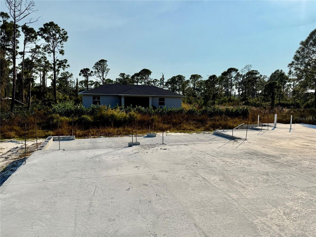 Photo of 14185 Banos Avenue, Port Charlotte, FL 33981 (MLS # C7517103)