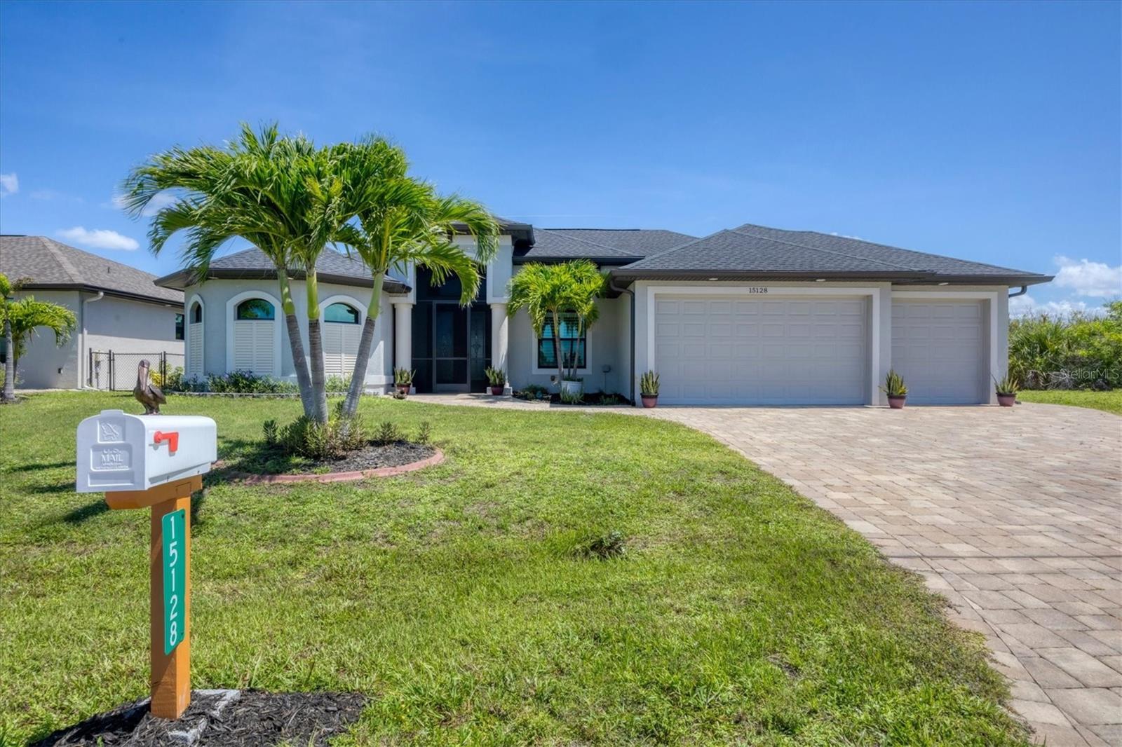Lovely Waterfront Home in South Gulf Cove. This 2016 DM Dean Custom Built Pool home is a 3bed 2bath with Den and is perfect for anyone wanting that Waterfront Lifestyle in a great community. Nestled in the heart of the community with easy access via 3 of the 4 main entrances this area is serviced by sidewalks on all main roads and surrounded by like style homes. Once inside you will notice the Open Floor Plan with Extensive Views of the Lanai, Pool and Canal from Livingroom, Kitchen and Dining nook. The Impressive 14 foot Tall tray ceilings open the space up and zero corner impact sliders make the area light and bright. The Kitchen has been designed to have Maximum Storage with Large Counter Areas great for Entertaining. The Private Den area is in the front of the home and Being used as an Office but could be used as a Flex Space. The Split bedroom Floorplan gives guests and Owners Space and Privacy. The large Owners bedroom encompasses the whole left side of home and Features Sliders to the lanai, Two walk in Closets, a Roman Shower and Dual sinks. On the left side of the home you will find the Two Guest bedrooms along with the Second Bathroom which also Doubles as the Pool bath from the Lanai. This home has a separate laundry room and a 3 Car Garage for all your storage needs. Lounge and Entertain on your Lanai & Pool Deck. This Home has a North Facing Rear so No direct Sun into the Lanai offering Shade under the Lanai and Sun on the Pool Area. Enjoy Sunsets on the Dock or do a Little Fishing. Features include Porcelain tile throughout, Granite Counter Surfaces, Paver Driveway and Pool Deck. All Cabinetry has Soft close doors and drawers, Appliances are all Stainless Steel. Hurricane Impact windows and doors are an energy saver and give a discount on homeowners insurance. Check out this home and find your piece of paradise. The Vacant Lot next door is available for purchase from seperate owner D6143166.