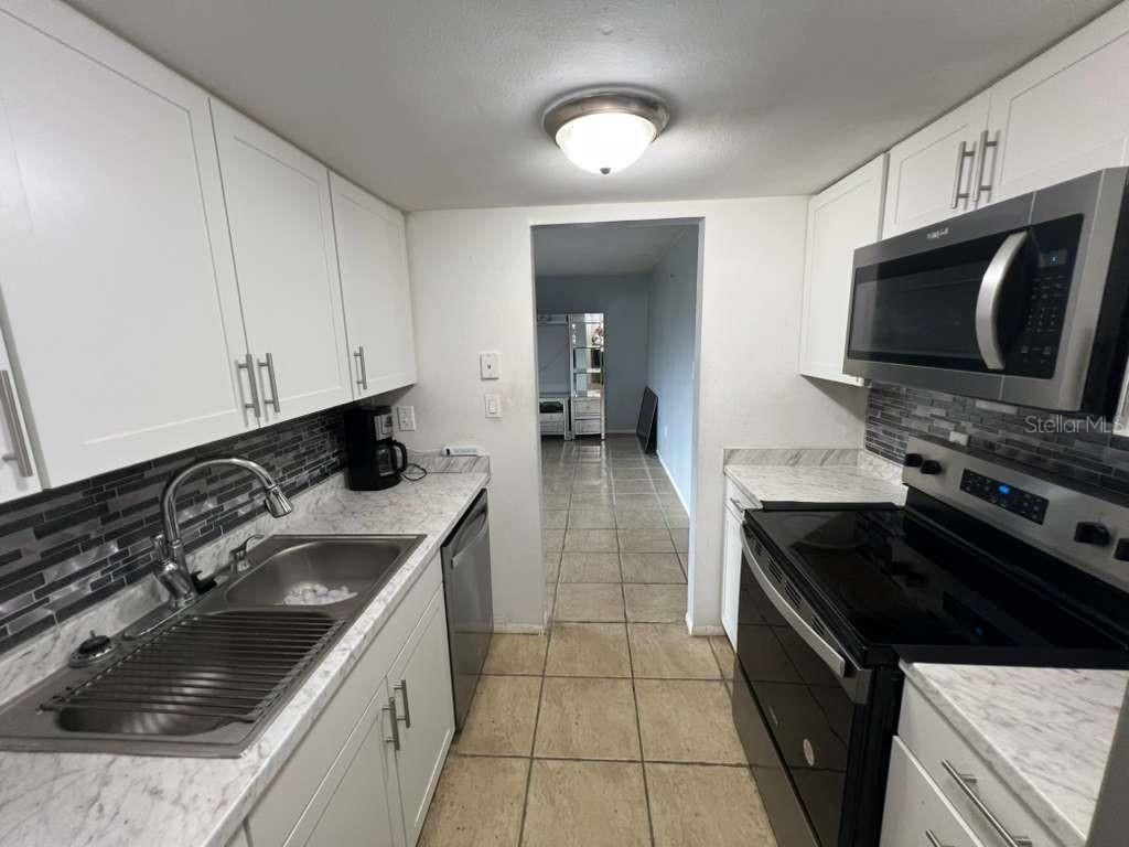 Photo of 851 Sky Lake Circle #D, Orlando, FL 32809 (MLS # O6351498)