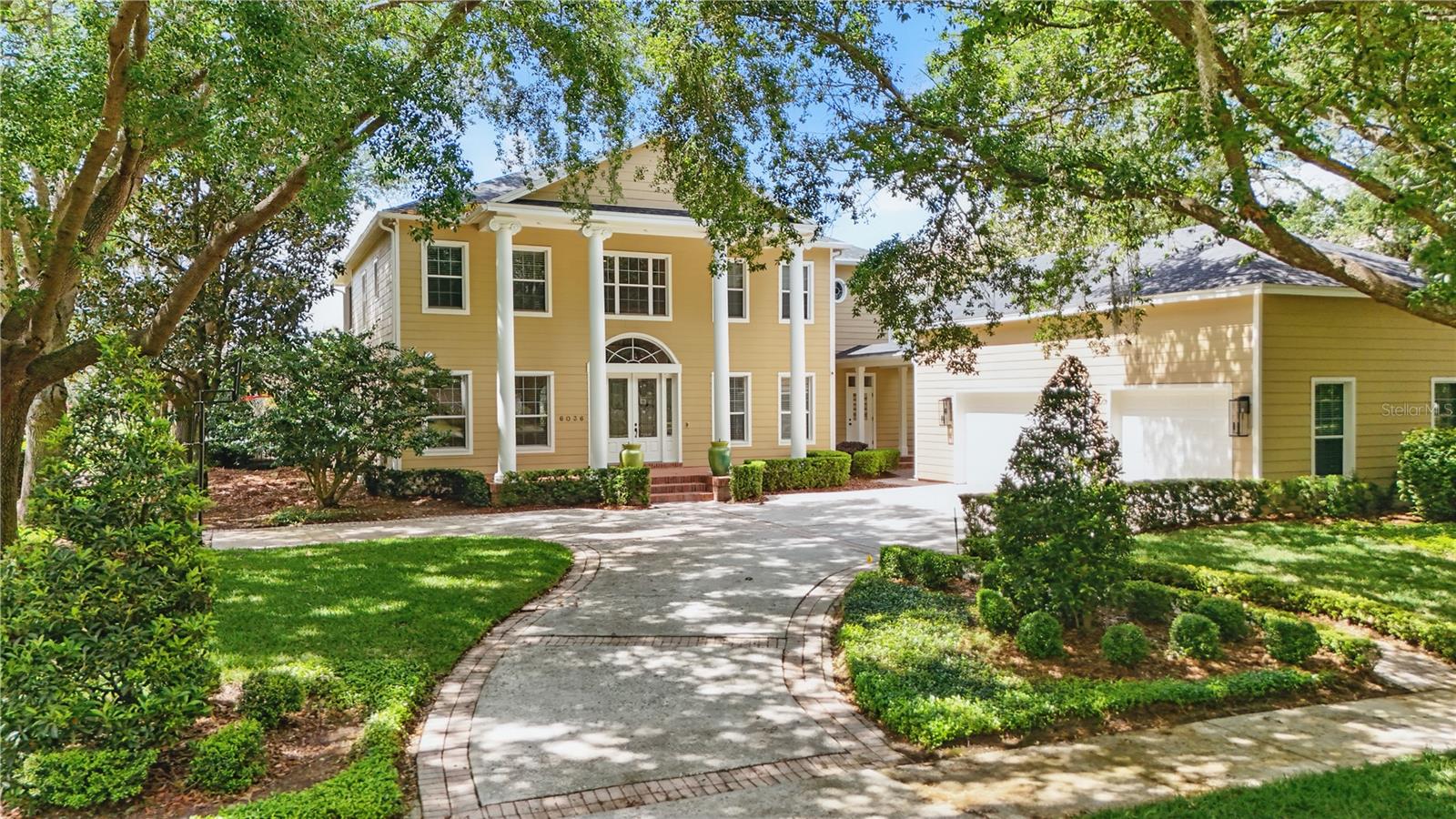 One or more photo(s) has been virtually staged. Welcome to Keene’s Pointe! Discover the charm of this custom-built home located on the 17th Fairway of the renown Jack Nicklaus Signature Golf Course and across from the lakefront mansions that line this quiet cul-de- sac on Greatwater Drive. This 4BR/4Full Bath/1 Half Bath golf course home exudes warmth from the gorgeous hardwood floors and bathed in abundant natural light. You will find your main living area on the first floor to include the Kitchen- Family Room combination that opens to a gorgeous pool and golf course view. Additionally, there is a formal dining room with butlers pantry/coffee bar to serve you, along with a spacious home office area and a formal living room opening to the patio and 1 of the 4 Bedrooms which also opens to the patio. The Primary and two other Ensuite Bedrooms are located upstairs, and all enjoy access to an enormous balcony that stretches the full length of the back of the house with stunning sunset views and wide golf course vistas. A spacious laundry room is also located upstairs. Bathrooms have been updated and the kitchen has been remodeled featuring new top of the line stainless steel appliances: Wolf gas cooktop, Sub-Zero refrigerator & Bosch dishwasher. Butler Pantry boasts Miele coffee maker and wine cooler and a tall “wine captain” is the focal point of the dining room. New carpet in all bedrooms, fresh interior paint and all new LED lights throughout. Fabulous, covered pool area with paver deck is a great spot to watch the sunset and enjoy the fabulous golf course views. The large swing on the patio is a delight and makes life worth living! Sit back, relax and enjoy!