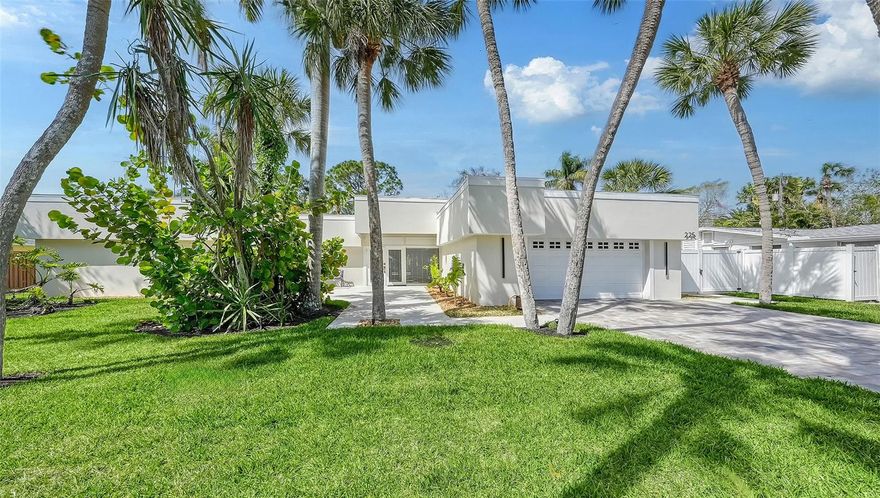 Rarely available on St. Armands...move in ready...tastefully updated 4BR, 3BA pool home.  Convenient to Lido Beach, dining and shopping on St. Armands Circle and downtown Sarasota.  Modern exterior features parapet facade, new roof and open courtyard entrance.  Enter into a sunlit open split floor plan, featuring volume ceilings in oversized great room, sizeable eat-in kitchen, offering expansive view of outdoor living at its best including a saltwater pool, outdoor rain shower and oversized pool deck framed by lush landscaping and privacy fence.  Entertaining is made easy by the pass-through window from the kitchen to the outside dining counter.  Large master suite overlooking the pool with luxurious master bath showcasing a glass enclosed walk-in double shower with two oversized rain heads, two above counter sinks, bidet and beautiful cabinetry.  Other features include ceramic tile throughout and attached two car garage with epoxy floor.   Come  enjoy the Florida lifestyle at its best!