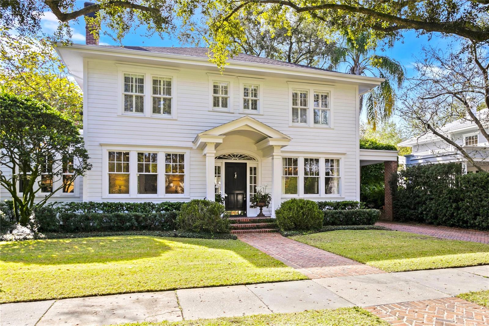 Ideally located on a picturesque tree lined street in South Tampa's popular New Suburb Beautiful neighborhood, this elegant home remains true to its classic style. Originally built in 1925 and situated on a meticulously landscaped 60 x 138 lot, the home has been lovingly maintained and has undergone many upgrades over the years. Recent renovations include an open concept kitchen remodel and a new roof in 2023. The home offers high ceilings, original heart of pine and oak flooring, custom millwork and cabinetry, extensive crown and base moldings, wood burning fireplace, pool with spa, and herringbone patterned brick drive & walkways. The entry foyer is flanked by formal living and dining rooms plus an office beyond. The well-appointed cook’s kitchen is sure to please with its oversized island, marble countertops, breakfast bar, Wolf and Sub-Zero appliances, a 146-bottle wine refrigerator and a handy hidden pantry. From there, enjoy a light & bright breakfast area with French doors leading to the lanai overlooking the pool and manicured landscape. Upstairs features 3 bedrooms with ensuite baths, a primary suite with an enviable custom walk-in closet and marble floored luxury bath with dual vanities, a garden tub and separate shower. A generous laundry room with sink, bonus room with an ensuite bath, and balcony overlooking the pool, plus a back staircase to poolside, completes the second floor. Situated in the Mitchell/Coleman/Plant school district and close to Palma Ceia Golf & Country Club, Hyde Park Village, Bayshore Boulevard, Downtown Tampa, shops, and dining.
