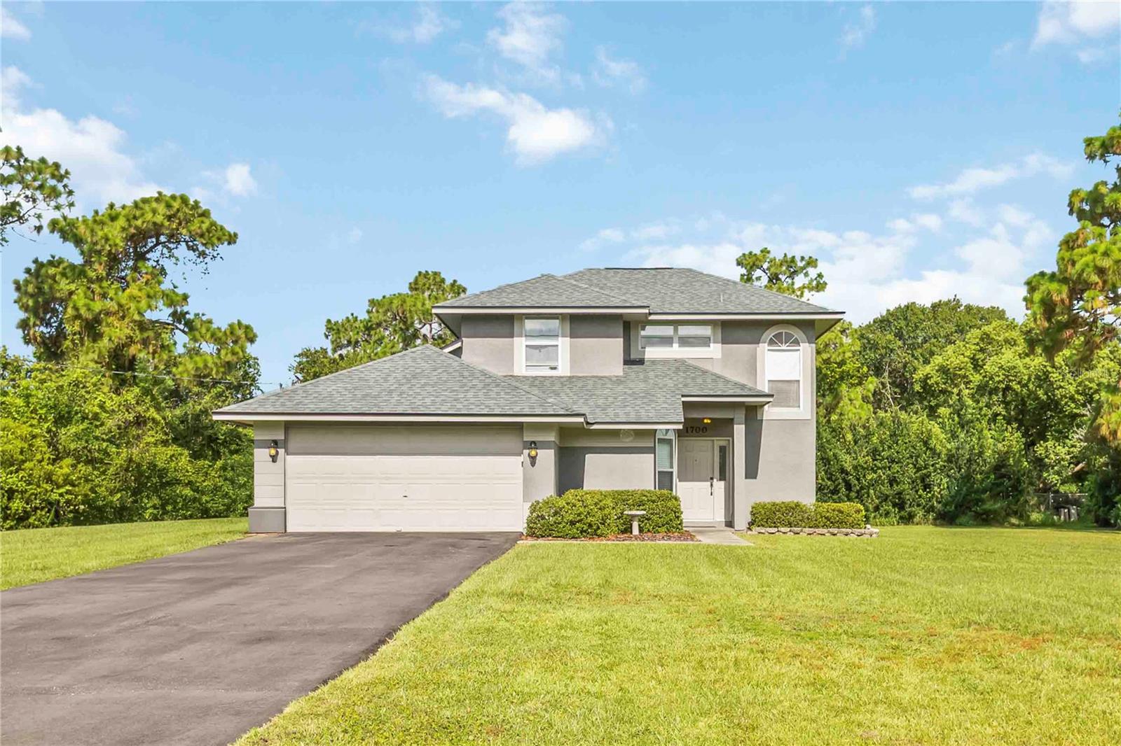 Nestled on a generous 0.47 acre lot, this delightful 3-bedroom, 2-bath 2-story home offers the perfect blend of peaceful country living and easy access to modern amenities. Spacious split floor plan includes an open concept living and dining area ideal for entertaining, with the master suite downstairs, loft and two bedroom are located upstairs. Covered screened in porch and expansive yard is perfect for gardening, outdoor gatherings, or even adding a pool. Enjoy a quiet, country setting with room to breathe and enjoy nature. Located minutes from shopping, Veteran's Hospital, Orlando International Airport and Orlando's Area Attractions. Whether you're looking for tranquility, space, or convenience, this home checks every box.