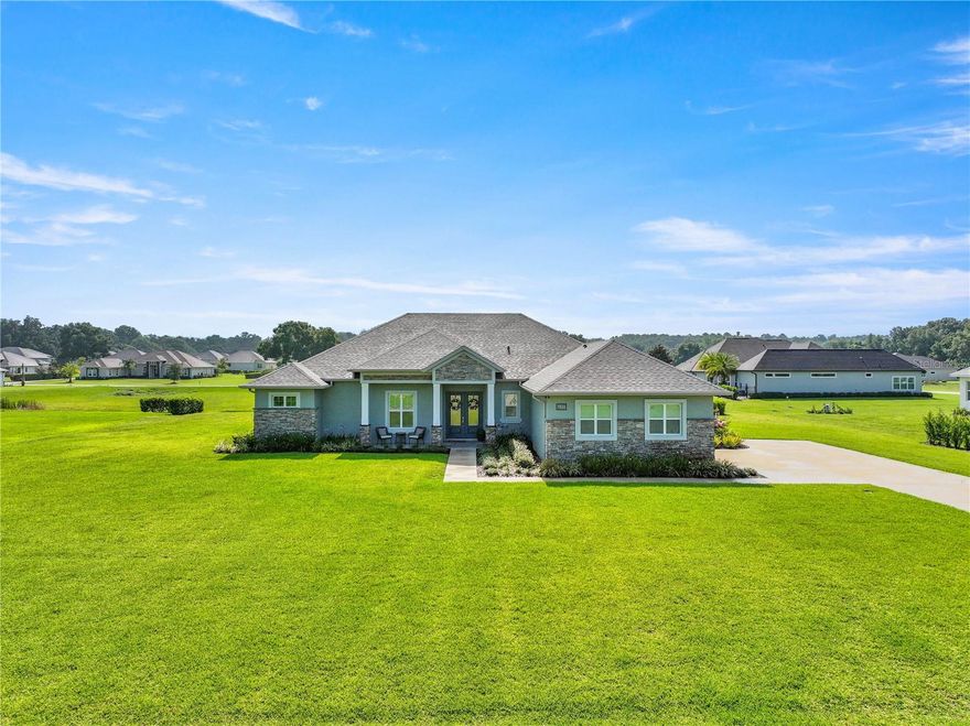 Stunning beauty in sought after Legendary Trails!! This magnificent Center State 3 bedroom 3 bath home was constructed in 2022 and is a masterpiece. The large, open concept great room greets you with plenty of space for entertaining or just hanging out. The large kitchen has 42" upper cabinets with Maple fronts and crown molding. The counters are Quartz and the appliances are Stainless Steel. Truly a chef's dream! The bedrooms are all very spacious and have en suite baths as well as a HOME OFFICE that is ample size. The large Master bedroom is truly an oasis including a spa like bath. There is a very large bonus room that is a perfect space for whatever works for your lifestyle. The floors are all LVP floor for beauty and durability and bedrooms 2 and 3 are carpet for extra warmth. The 12' ceilings in the main living areas give lots of drama and the bedrooms are all 10' ceilings. But the most spectacular part of this beauty is the luxurious outdoor living and views! This home was built on a premium lot that backs up to a greenspace so the views are unobstructed and adds lots of privacy. And the POOL area is a perfect place to sit and take it all in. The cocktail pool area is fully screened in and boasts lots of seating and dining space. There is a full summer kitchen as well which is fully set up for outdoor cooking and entertaining. This is truly a legend in Legendary Trails!