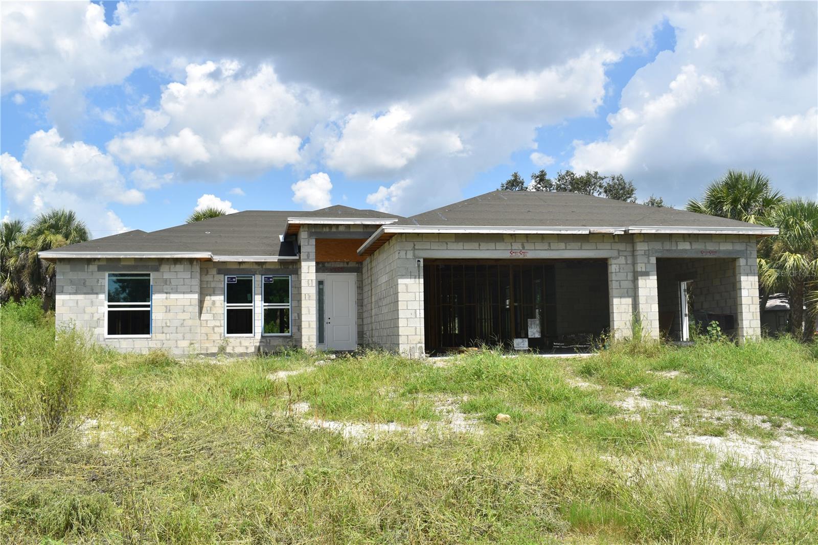 Under Construction. Bring your vision and make this Florida dream home your own! This partially finished North Port residence sits on a spacious DOUBLE LOT with CITY WATER and features 3 BEDROOM + DEN, 2 BATH, SPLIT and OPEN FLOOR PLAN, 3-CAR GARAGE offers plenty of room for vehicles, storage, or hobbies, HURRICANE IMPACT WINDOWS & DOORS, roughed-in ductwork for A/C, and COMPLETED FRAMING. The versatile DEN INCLUDES A SEPARATE OUTDOOR ENTRANCE, can be a private office, extra sitting room or guest suite.The OVERSIZED LANAI is perfect for entertaining, and the INSIDE LAUNDRY ROOM adds everyday convenience. Just over a MILE FROM WARM MINERAL SPRINGS and close to Gulf of Mexico Beaches, the new Costco, Atlanta Braves Spring Training Stadium, shopping, dining, and all SouthWest Florida's attractions - this property offers both convenience and opportunity in a prime location. Existing plans and permits are available, giving you the chance to customize every detail to your taste and create the ideal primary residence, vacation retreat, or income-producing property.
Investment or Finish-to-Your-Taste Opportunity!