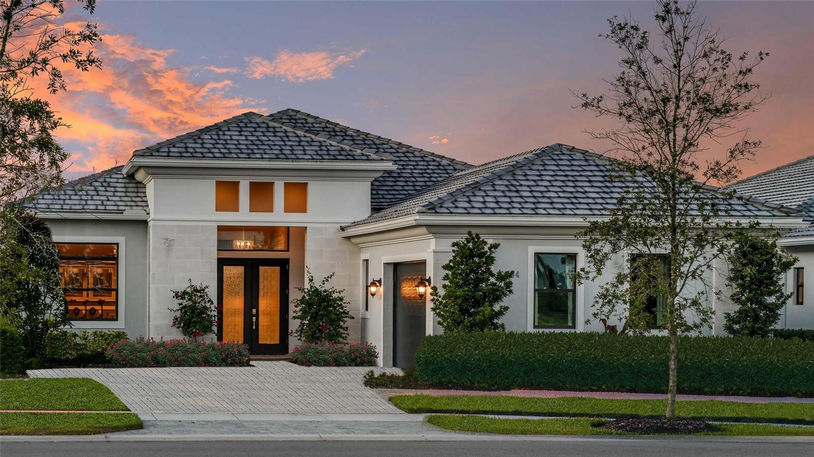 **New Construction** Decorated Model - fully furnished home (photos are actual home) with designer-appointed features that include impact glass windows, custom closet organizers, elegant tray ceilings with shiplap accents, and an extended covered lanai. This home offers the perfect blend of style and functionality in a desirable lakeside setting. This 3-Bedroom model home with a Den, immediately sets a welcoming tone with its double-door Covered Entry. From the arrival, the home opens to the Great Room with a formal Dining Room to the right and Club Room to the left. Kitchen highlights include a Butler's Pantry and a large island. The Great Room's triple-slider door to the Covered Lanai, along with four additional rear windows, capture Artistry Sarasota's deep backyards and its pristine wooded and waterfront views. Artistry Sarasota is a new home community in Sarasota, FL, that features Kolter Homes’ award-winning floorplans and amenities. This gated community is located away from the congestion in the growing Sarasota East area and offers residents easy access to the region's best shopping, dining, beaches, recreation and entertainment. A number of top-ranked golf courses including The Founders Club and Laurel Oak Country Club are in the immediate vicinity, the Sarasota Theatre & Arts District is 10 miles away, and Sarasota-Bradenton International Airport is a 14.5-mile drive. Seller will convert club room to 3rd bedroom with ensuite if purchaser elects.