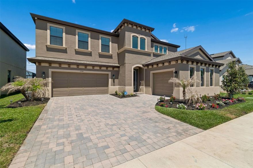 Luxury-comfort-upgrades. Step into a statement of modern elegance in the highly sought-after community of Triple Creek where luxury, comfort, and lifestyle come together in one exceptional, showstopping home which offers 5 bedrooms/4.5 baths Plus Bonus room, almost 4,300sqft. Built by West Bay Homes with exquisite upgrades that will astonish any buyer! Step through a grand entryway with a 2-story ceiling and striking modern chandeliers that immediately set the tone for this designer-decorated residence. Expansive folding sliding glass doors frame the breathtaking saltwater pool and pond views, seamlessly blending indoor and outdoor living. Your dining room has a beautiful chandelier which adds to the elegance of the custom glass wine display that sets the tone for all family gatherings. A chef-inspired gourmet kitchen with upgraded Sonoma linen coastal cabinetry with Calcutta Novello Quartz countertops, which will captivate all your family and friends. Your gourmet kitchen also boasts sleek, modern SMART appliances, including a state-of-the-art remote-controlled range hood. Custom designer pendant lighting and under-cabinet illumination elevate the clean elegance and stylish function throughout the kitchen. The open-concept layout flows effortlessly into the family room, where tranquil water views create a serene backdrop. Step outside to your private resort-style oasis featuring a saltwater pool with a trendsetting custom light show outlined with upgraded Mansard tiled pavers surrounding this beautiful pool, and lush tropical landscaping. The large downstairs guest suite has a beautiful bath adjacent, perfect for a cherished guest or a quiet suite for the in-laws. Upstairs the primary suite is a true retreat, offering private outdoor access to the upstairs screened balcony. The spa-inspired master bath with floor-to-ceiling tiled shower and seamless glass enclosure completes your relaxation oasis. The expansive bonus room is ideal for a media room, play area, or second living space which will bring your entire family together. The bonus room is highlighted with a dual TV setup perfect for movie nights or watching multiple sporting events at once. This room also provides access to an expansive screened balcony that stretches the length of the home—perfect for relaxing evenings overlooking the water while watching Florida’s amazing sunsets. A convenient second-floor laundry room adds everyday ease as well. Some additional key features: 5 spacious bedrooms /4.5 luxurious bathrooms/3 car garage; Elegant French doors leading to a dedicated home office; Pool bath with modern designer finishes; custom designed fireplace with porcelain tile; 3-car garage with epoxy flooring. Upgraded lighting and recessed fixtures throughout the home. Pavered driveway and enhanced landscaping with a modern irrigation system. A home water softener as well. Residents of Triple Creek enjoy resort-style amenities including multiple pools, fitness centers, playgrounds, walking trails, basketball courts, and a vibrant, master-planned community. The home is also zoned for highly regarded schools, including Dawson Elementary School, Barrington Middle School, and Sumner HS. This house will not last long so schedule your private showing today and experience the lifestyle you have always wanted within this exceptional home.