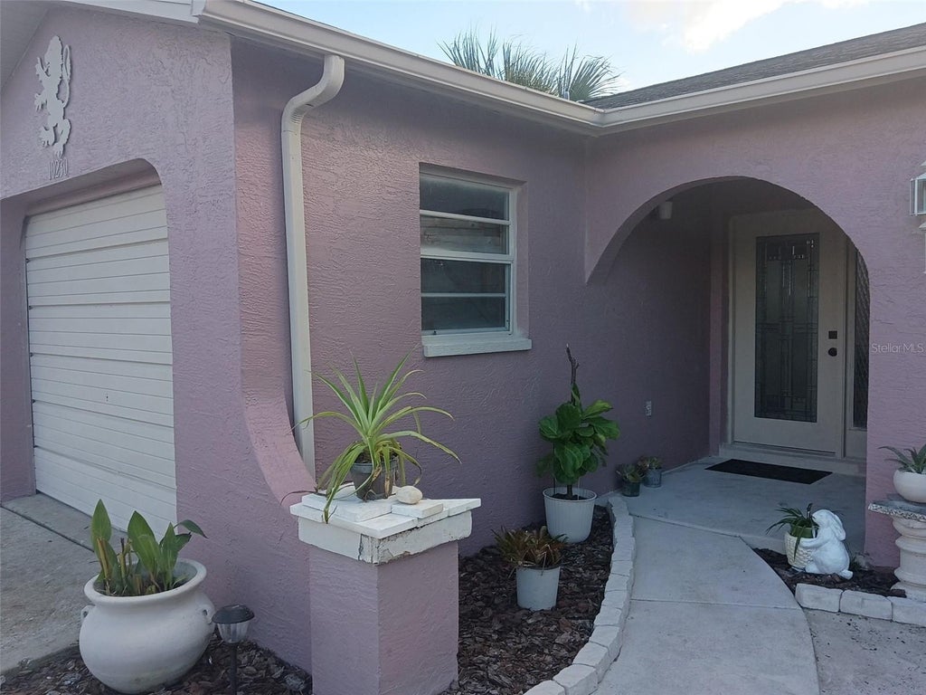 Photo of 10230 Autumnwood Drive, Hudson, FL 34667 (MLS # W7890617)