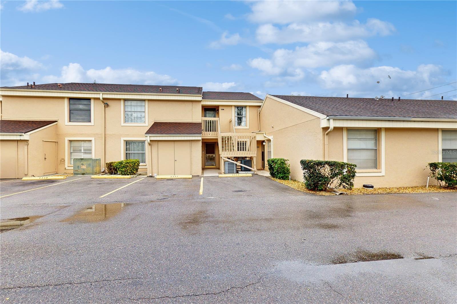 Welcome to this beautiful first floor condo, with reserved parking, in the Pebble Springs community where serenity and convenience meet. The property has 3 bedrooms, 2 full bathrooms, a split floor plan for added privacy and comfort between the primary bedroom and secondary bedrooms, as well as a wonderful open concept layout encompassing the living room, dining nook, and kitchen-perfect for everyday living and entertaining. The primary bedroom has a generously sized walk-in closet as well as an en-suite bathroom. The second bathroom features a jacuzzi tub that is perfect for relaxing after long day. Recent updates include a fully renovated kitchen featuring new white cabinetry, quartz countertops and stainless steel appliances, fresh paint throughout, HVAC (2021), and a new electric panel (2023). You'll be delighted at the amount of natural light found here, as well as the upgraded flooring (no carpet), and in unit laundry hookups. From the living room through the rear sliders, you'll find the patio, perfect for early morning coffee or relaxing after a long day with views of the community pool. Pebble Springs is a pet friendly, all ages community, making it perfect to fit your needs and lifestyle. Conveniently located near dining, shopping, medical facilities, and only 7 miles from the stunning gulf coast beaches! Don't miss your opportunity to call this one home, schedule your showing today!!