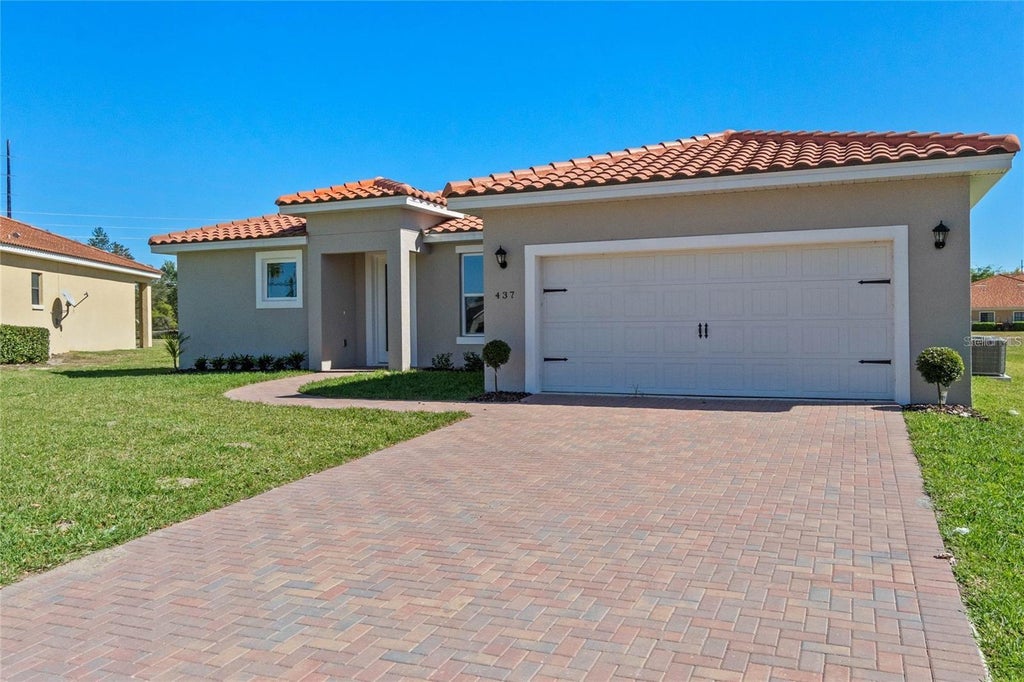 Photo of 409 Cinnamon Drive, Poinciana, FL 34759 (MLS # O6448170)
