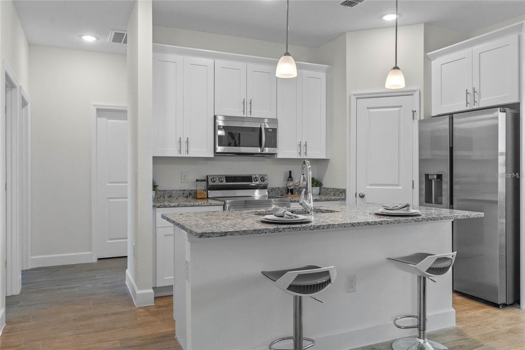 Photo of 409 Cinnamon Drive, Poinciana, FL 34759 (MLS # O6448170)
