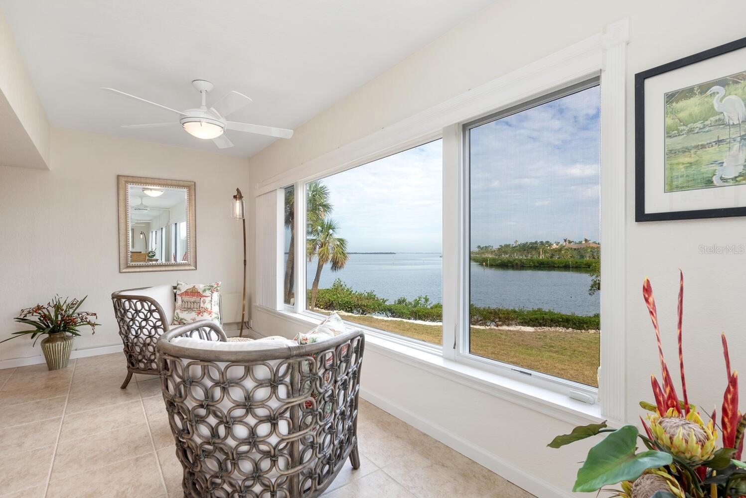 Beach, Bay & Boating! This beautifully renovated condo offers breathtaking views of the serene waters of Cranes Bayou and the Intercoastal. Thoughtfully designed for both comfort and style, the kitchen features a peninsula dining table, allowing guests to join in the culinary experience. High-end finishes, including solid maple cabinetry with dovetail drawers, quartz countertops and backsplash, recessed lighting, and built-in wine storage, showcase exceptional craftsmanship. The spa-like bathrooms boast floor-to-ceiling tile, frameless glass shower enclosures, shower niches, elegant vanities with stone countertops, and backlit mirrors. Generously sized rooms provide ample closet space, ensuring both luxury and practicality. From the Florida Room, take in stunning views of dolphins gliding through the bayou, an eagle perched in its nest, or the sun rising over the horizon. Ideal for water enthusiasts, the community offers boat docks, kayak storage, a launch for jet skis, paddleboards, and kayaks, as well as deeded beach access just across the street. Additional updates include a brand-new hot water heater (12/24), a newer A/C system (2018), and updated plumbing. An incredible value under a million!