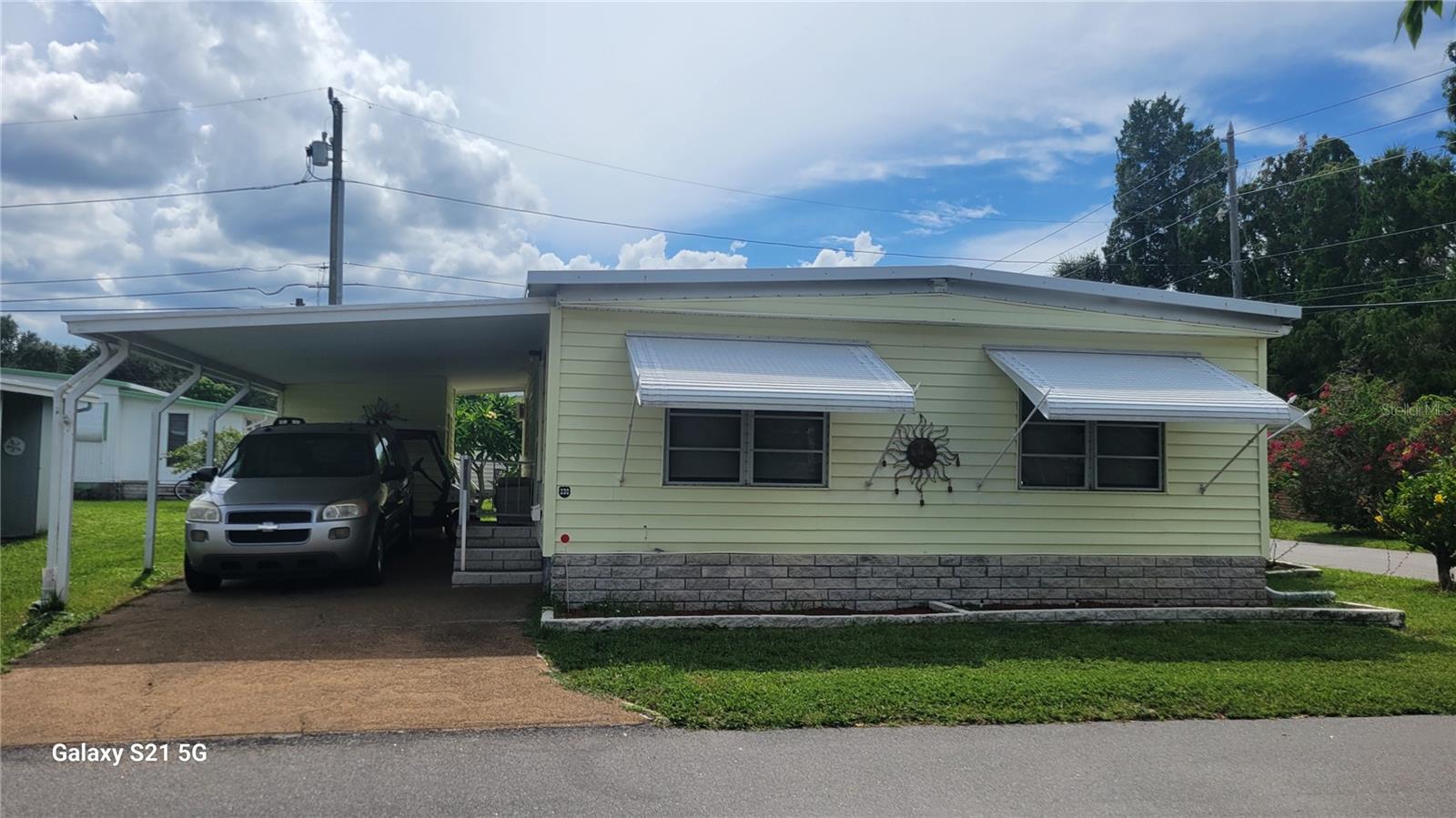 Great opportunity to purchase this 2-bedroom 2 bath doublewide mobile home in the private Tampa Bay-front community of Sky Harbor Estates. Many upgrades include floors redone and reinforced or replaced. New carpet and decorator wood-look laminate/ flooring recently installed. HVAC just serviced with new parts to operate efficiently, unit installed new in 2019. Plus new window air conditioner for primary bedroom. All light fixtures replaced, interior painting done throughout, hall bathroom redone with new plumbing, new vanity and flooring, including new shower stall replacement. Energy efficient skylights in select rooms. Bonus Florida room has area for guest sleeping as well as game table or second eating space. Most furnishings are including, turnkey for new owner to enjoy their winter 2nd home or full-time residence. You own the lot and low homeowners fee included water, trash, sewer exterior lawn maintenance, pool heated and cooled, clubhouse, shuffleboard,and waterfront area for fishing, kayaking or canoeing or just sitting to observe the peaceful waterfront area , great sunrises and sunsets. Snowbirds activities make it easy to find friends and neighbors to enjoy the retired lifestyle. Conveniently located just steps from shopping and restaurants. Beach and airports a short drive away. See it today!!