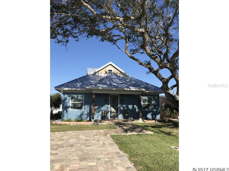 BRAND NEW CONSTRUCTION.  Walk to the beach from this gorgeous new custom built home surrounded by 2 spectacular oaks.  Everything is brand new.  Too many upgrades to list. You can see the ocean from the driveway.  Beautiful tile throughout the main floor.  There is a bedroom, full bath, & den upstairs.  Lovely quartz counter tops.  Storm impact windows throughout.  Tankless water heater. Tons of storage space.  Natural gas lines for grill and firepit.  Fantastic large screened porch.  Oversized detached 2 car garage with storm impact windows and metal roof to match the house.  Hot & cold shower outside with enclosure for privacy.  Must see this beautiful house. ;Water: City