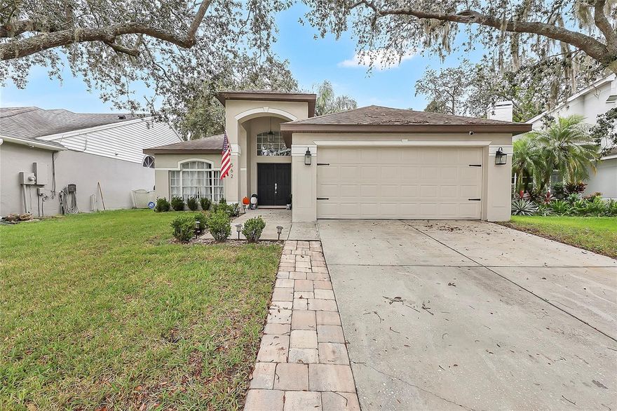 Step into this beautifully updated home in Tusca Oaks where modern comfort meets everyday convenience. The open-concept layout features soaring vaulted ceilings, skylights, and plenty of natural light that flows seamlessly through the living, dining, and kitchen areas. The kitchen is a true highlight, showcasing crisp white cabinetry, quartz countertops with waterfall edges, stainless-steel appliances, and a breakfast bar perfect for casual meals or entertaining. The spacious living room offers a cozy yet airy feel, complete with recessed lighting, and views of both the dining space and the screened lanai.

The master suite is a relaxing retreat with a spa-like bathroom featuring dual vanities, a frameless glass shower, soaking tub, and a walk-in closet. Additional living spaces include a flexible den/sitting area and secondary bedrooms that offer comfort and versatility. Important updates include a 2020 roof for peace of mind. Step outside to enjoy the large screened-in patio overlooking a private, fully fenced backyard shaded by mature oak trees. The paver patio with hot tub and space for grilling makes it ideal for gatherings and Florida evenings outdoors. Located in a sought-after Winter Springs neighborhood, this home is close to parks, shopping, dining, and top-rated schools—making it the perfect blend of style, function, and location. Tuscawilla also offers an optional HOA with membership opportunities for the golf course and access to their private clubhouse pool.