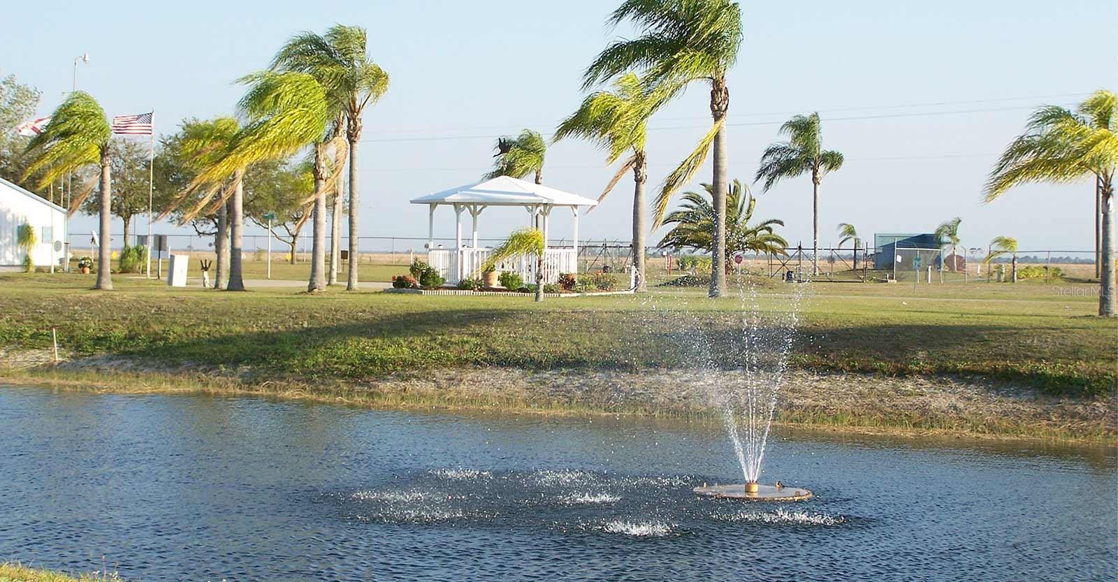 46900 Bermont Rd, Phase 1 - Unit 115, Punta Gorda, FL 33982 is in Paradise Park, a gated, pet-friendly 55+ community spanning 136 beautifully maintained acres. Our property features a 1,269 sq ft concrete pad, perfect for your Airstream, RV, Class A Motorhome. No 5th wheelers are allowed. It also includes an 8' by 10' shed room with shower, toilet, sink, refrigerator and storage. For your convenience, this lot is a conveniently located close to all the amenities. Featured is the heated pool, clubhouse, and laundry facilities. The community post office is located right at the end of the street. Paradise Park is a vibrant lifestyle destination where residents enjoy a wide range of amenities, including: a 9-hole golf course; Heated swimming pool; Expansive recreation hall; Billiard tables and a fitness center; Shuffleboard and bocce ball courts; A scenic 5-acre fishing lake and horseshoe pits; Metal and woodworking shops; On-site washers and dryers; Community fire truck; library; defibrillator; and a regularly published newsletter. Each resident owns an equal share of the communal areas, recreational facilities, and the private utility systems including the park's independently operated water and sewer treatment systems. The social calendar is always full, with activities such as: Craft and dance classes, Pool tournaments and entertainment nights, Sewing circles, bingo, card games, as well as Water aerobics and fitness programs. Schedule your visit next.
