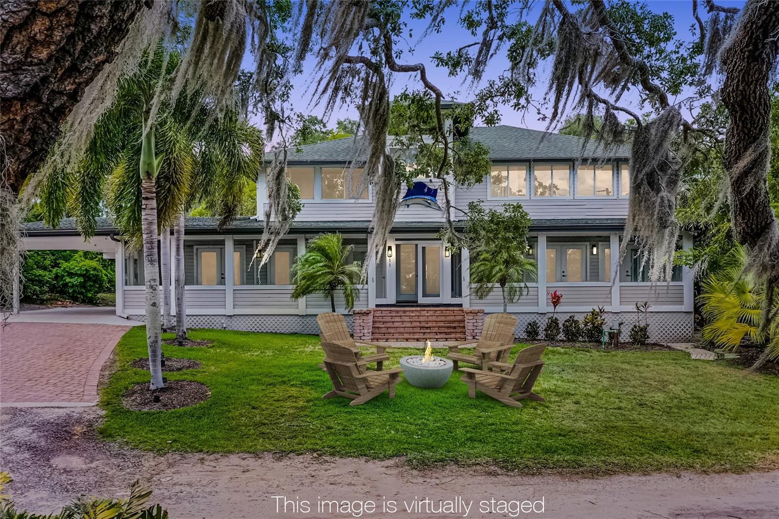 Luxury Lakefront Living in Downtown Windermere.
Don’t miss this rare opportunity to live on the pristine shores of Lake Bessie, just moments from charming Downtown Windermere. Perfectly positioned in one of Central Florida’s most desirable communities, this lakefront retreat offers unbeatable views, unmatched privacy, and the freedom of no HOA restrictions.
From the moment you arrive, you’re welcomed onto a spacious screened front porch—ideal for morning coffee or evening breezes off the lake. Inside, the open floor plan blends comfort and style, featuring a chef’s kitchen with stainless steel appliances, natural gas range, breakfast bar, and custom cabinetry. The dining room, warmed by a cozy fireplace, overlooks a tranquil koi pond with a rock waterfall, while sunlit living spaces showcase water views from nearly every angle.
Two ensuite bedrooms are located on the main floor, while the upstairs primary suite boasts panoramic views of Lake Bessie and the golf course beyond, a spa-inspired bath with dual vanities, and a generous walk-in closet. Outside, enjoy lake life at its finest—trade stories by the firepit, fish or paddleboard from your shoreline, or simply take in the peaceful scenery.
Recent updates within the last five years include a 50-year architectural roof, Carrier AC units, water softener, new flooring, drain field, and fresh interior and exterior paint.
This property also provides access to the Lake Butler public dock and nearby tennis courts for even more recreational options. Zoned for well-regarded public schools, Windermere is also known for its golf cart–friendly streets, weekly farmers markets, monthly food truck nights, festive events, and easy access to parks, playgrounds, and the Butler Chain of Lakes. One or more photo(s) has been virtually Staged