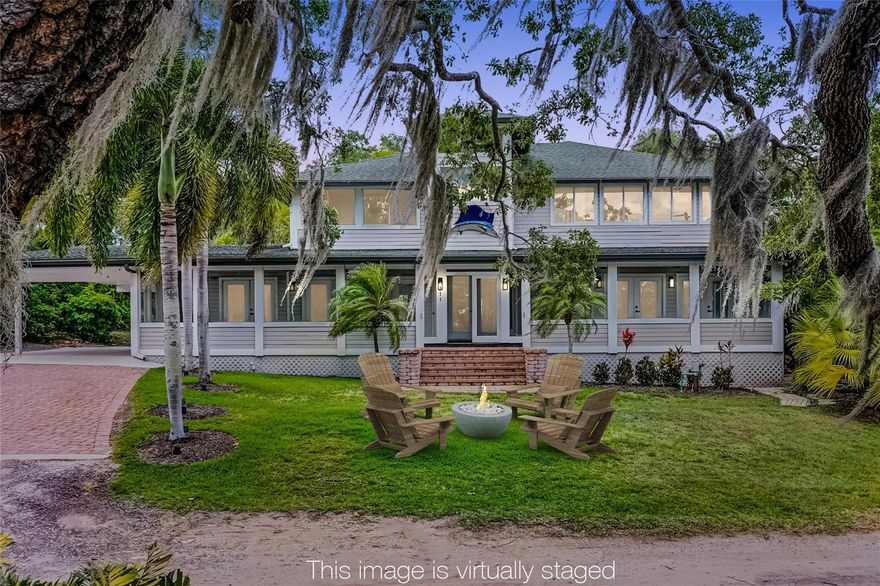Luxury Lakefront Living in Downtown Windermere. 
Don’t miss this rare opportunity to live on the pristine shores of Lake Bessie, just moments from charming Downtown Windermere. Perfectly positioned in one of Central Florida’s most desirable communities, this lakefront retreat offers unbeatable views, unmatched privacy, and the freedom of no HOA restrictions.

From the moment you arrive, you’re welcomed onto a spacious screened front porch—ideal for morning coffee or evening breezes off the lake. Inside, the open floor plan blends comfort and style, featuring a chef’s kitchen with stainless steel appliances, natural gas range, breakfast bar, and custom cabinetry. The dining room, warmed by a cozy fireplace, overlooks a tranquil koi pond with a rock waterfall, while sunlit living spaces showcase water views from nearly every angle.

Two ensuite bedrooms are located on the main floor, while the upstairs primary suite boasts panoramic views of Lake Bessie and the golf course beyond, a spa-inspired bath with dual vanities, and a generous walk-in closet. Outside, enjoy lake life at its finest—trade stories by the firepit, fish or paddleboard from your shoreline, or simply take in the peaceful scenery.
Recent updates within the last five years include a 50-year architectural roof, Carrier AC units, water softener, new flooring, drain field, and fresh interior and exterior paint.
This property also provides access to the Lake Butler public dock and nearby tennis courts for even more recreational options. Zoned for well-regarded public schools, Windermere is also known for its golf cart–friendly streets, weekly farmers markets, monthly food truck nights, festive events, and easy access to parks, playgrounds, and the Butler Chain of Lakes. One or more photo(s) has been virtually Staged