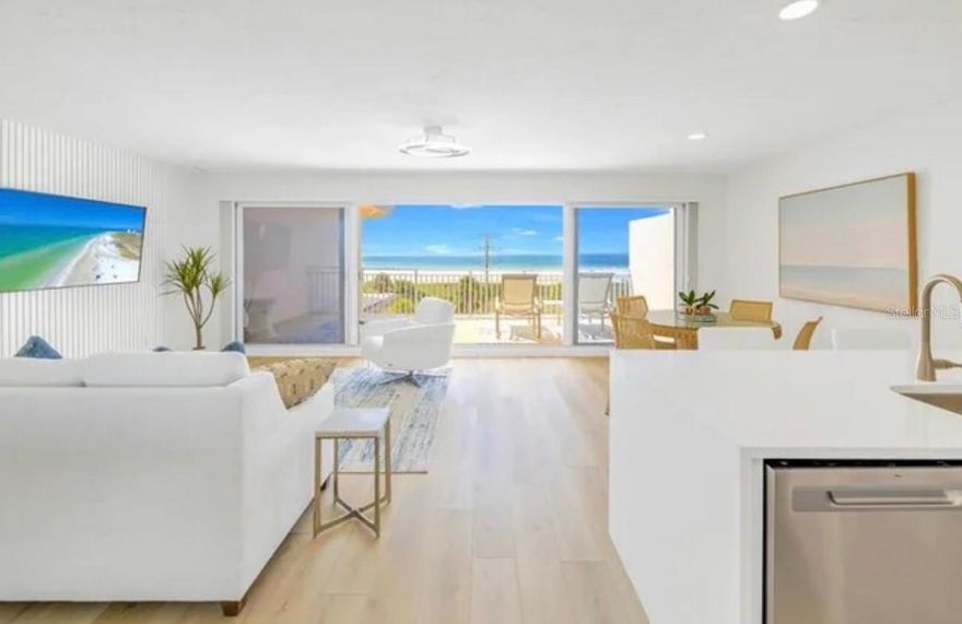 **This is the One! Coastal Contemporary Beachside Living!** Welcome to the stunning Penthouse-level, 4th-floor residence at Sunset Royale with beautiful unobstructed Gulf-facing views! Enjoy every sunrise and sunset! Ideally positioned just across the street from world-renowned Siesta Key Beach. This truly move-in ready condo has been beautifully renovated throughout, offering a light-filled coastal interior and effortless flow.

The kitchen is a true centerpiece, featuring high-end quartz countertops and backsplash, a large waterfall-edge island, solid wood custom cabinetry, and newer appliances (approximately 2 years). The open layout flows seamlessly into the living space with a fantastic accent wall and out to the balcony, where you can enjoy sweeping Beach/Gulf views.

Additional highlights include an in-unit washer and dryer, a newer water heater, and a beautifully updated bathroom with a walk-in shower. A thoughtfully designed welcome area inside the unit provides a perfect arrival space with games, guides, and local information.

This property also features an owner's storage unit ideal for beach chairs and gear, a designated parking space, and convenient building amenities including garbage chutes on both sides and two on-site grills available at no charge to owners and guests. Cable is included in the HOA fee, and the building features a new roof put on in 2025.

Flexible ownership options allow for **7-day rentals or longer**, with on-site management available through Prime Vacations (optional, not required). Whether for personal use or investment, this penthouse residence delivers the ultimate in convenience, comfort, and location in the heart of Siesta Key! A short stroll to Siesta Key village and only a few steps out to the beautiful white sandy beach! Reach out today to schedule your own private tour!