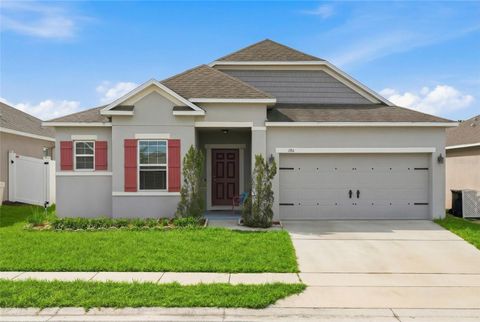 Photo of 186 Flatwoods Loop, Davenport, FL 33837 (MLS # O6398253)