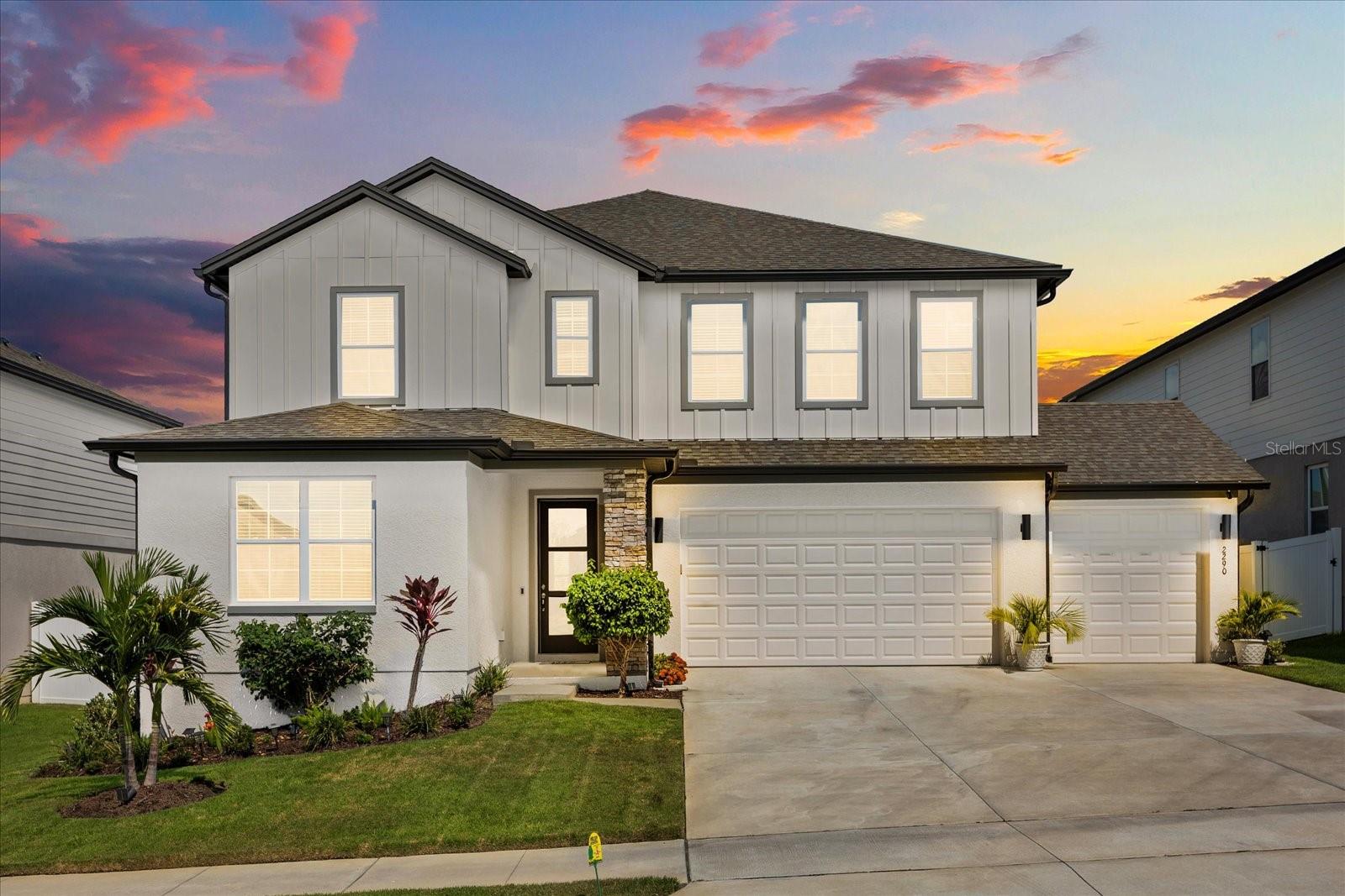 Designed for modern living and effortless entertaining, this beautifully crafted home in the sought-after Hills of Minneola provides a seamless blend of elegance, comfort, and functionality across two spacious levels.
At the heart of the home, a stylish open-concept kitchen features stainless steel appliances, a large island with seating, and easy flow into the living and dining areas—ideal for everything from casual gatherings to quiet evenings by the electric fireplace. A separate formal dining room adds flexibility for special occasions, while a private bedroom suite on the main floor provides a perfect space for guests. Just off the 3-car garage, a built-in mudroom with hooks, shoe racks, and storage cubbies keeps everyday life organized and efficient.
Upstairs, a versatile bonus room can transform into a media space, playroom, or family lounge. The expansive primary suite serves as a peaceful retreat with dual vanities, an oversized walk-in shower with dual showerheads, and a generous walk-in closet. Three additional bedrooms, two full bathrooms, and a conveniently located laundry room round out the upper level.
With 5 bedrooms, 4 full bathrooms, 1 half bath, and over 3,700 square feet of living space, this 2023-built home provides both space and style. Enjoy outdoor living on the covered patio overlooking a landscaped backyard, or take advantage of resort-style community amenities including a pool, fitness center, tennis courts, playground, dog park, and scenic walking trails. With top-rated schools, proximity to the future AdventHealth Minneola hospital, and quick access to Clermont, Winter Garden, and Downtown Orlando, this home truly offers the best of lifestyle, location, and livability.
