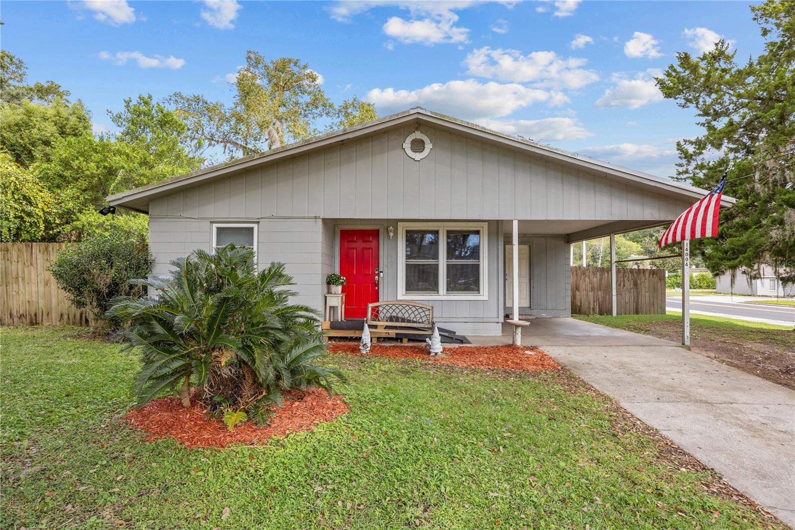 Welcome to this updated 3-bedroom home in the heart of Alachua. Built from solid concrete block and fully renovated in 2017, this home offers a practical layout, modern finishes, and a large fenced backyard.
Inside, you’ll find luxury vinyl plank flooring throughout the living, dining, and bedroom areas. The living room is bright and comfortable, opening into a dining space with sliding glass doors that lead directly to the backyard. The kitchen features dark wood cabinetry and updated appliances with plenty of workspace and storage.
The primary bedroom includes a private half-bath with a newer vanity and fixtures. Two additional bedrooms are well-sized and versatile, easily suited for family, guests, or a home office. The second bathroom has been tastefully updated to match the home’s clean, modern feel.
Step outside to a spacious, fully fenced yard with room for kids, pets, and outdoor gatherings. A shaded pergola patio offers the perfect spot to relax or host friends, and there’s also a storage shed for tools and equipment. The covered carport and long driveway provide plenty of parking options.
Located on a corner lot with beautiful mature trees, this home sits just footsteps from the local school bus stop and minutes from downtown Alachua’s parks, restaurants, and shops. With no HOA and no rental restrictions, it’s an excellent opportunity for homeowners or investors seeking a move-in-ready property in a convenient location.