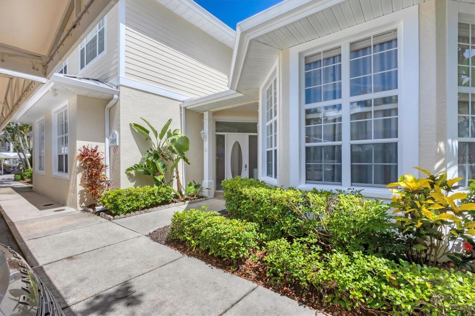 Available Now!! This is one of the largest properties in Bollettieri Resort Villas, with 3 bedrooms and 3 bathrooms upstairs plus an office/workout space (possible 4th bedroom) and 1 full bathroom downstairs. This unit has been fully renovated to include new floors, new bathroom showers, countertops, sinks and facets. Completely repainted inside and out. New furniture. Large, spacious living area with vaulted ceilings, tile and wood floors throughout with sliding glass doors that open to a private patio complete with outdoor furniture and a grill. Upgraded kitchen with stainless steel appliances and separate eating space in the kitchen. Upstairs, wood flooring throughout leading into a large master bedroom suite with walk-in closet with built-in shelving and a master bathroom featuring dual sinks and a walk-in shower. Two guest bedrooms offer en suite entrances to the adjoining bathrooms. King beds in the master bedroom suite and both guest bedrooms. A Peloton bike, Peloton treadmill and free weights are available to use on the first floor. 2 covered parking spaces are included.
Rate includes electric, water, sewer, garbage, pest control, Wi-Fi internet and basic cable. Gated community, within a short distance to community pool and spa and IMG facilities. Listed rate is for 6+ months. $6950 per month August 2025.