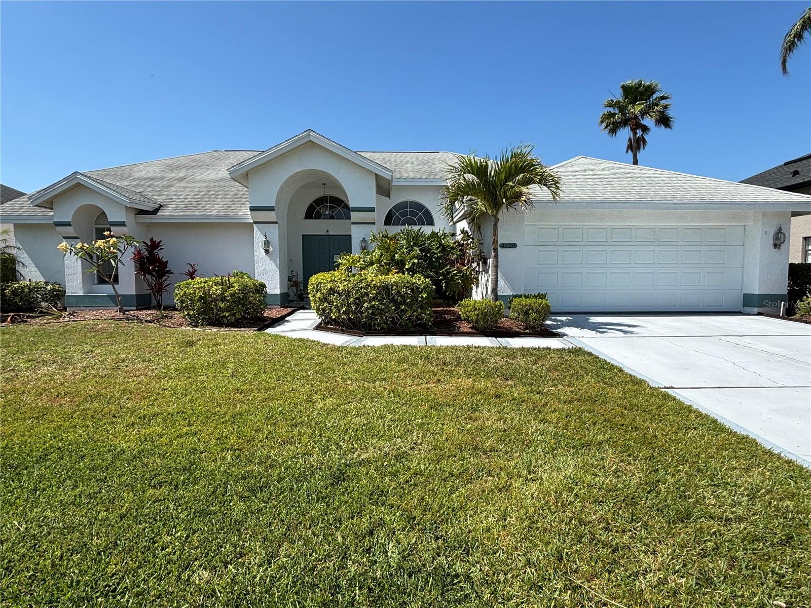 Welcome to your dream home in Peridia Golf & Country Club—where luxury meets lifestyle! From the moment you arrive, the beautifully landscaped curb appeal sets the stage for the exceptional quality inside this meticulously maintained 3-bedroom, 2.5-bathroom residence. The coveted split floor plan offers both privacy and open-concept living, with a bright, airy interior accentuated by elegant neutral tile flooring throughout.
Step into the heart of the home: a stunning chef’s kitchen featuring granite countertops, a wraparound breakfast bar, and stainless steel appliances updated Dishwasher 2019, Refrigerator 2021 and Dryer 2023. Adjacent to the kitchen, the inviting family room beckons with a cozy wood-burning fireplace—the perfect spot for intimate gatherings or relaxed evenings.
The spacious primary suite is your personal retreat, offering direct pool access and a spa-like en-suite bathroom complete with double sinks, a soaking tub, a separate shower with a stylish tile and glass enclosure, a private water closet, and a generous walk-in closet. Every detail is designed to elevate your everyday living, from the soaring high ceilings to the abundance of natural light. It also has a separate water heater so never worry about running out of hot water.
Step outside to your private sanctuary—a true resort-style backyard where a sparkling pool backs onto the 16th fairway of a beautifully manicured 18-hole executive golf course. A full wall of sliding glass doors floods the space with sunlight, effortlessly merging indoor and outdoor living. Enjoy al fresco dining in the spacious covered area, relax in the newly rescreened lanai, or unwind in the hot tub after a perfect day on the green. With a new pool pump motor installed in 2022, Hvac revamped and the Roofmax roof coating which prolongs the life of your roof, you are set for years of enjoyment.
Peridia is more than a community—it’s a vibrant lifestyle. Savor gourmet delights at the full-service restaurant and bar during Sunday brunch, or kick back at the tiki bar by the pool where live music on Friday evenings creates an irresistible atmosphere. With endless activities from tennis and pickleball to bridge and mahjong, every day here offers a new opportunity for fun and connection.
Additional community fees include a one-time contribution of $4,000, an annual Food & Beverage fee of $450, and an application fee of $100.
Don’t miss your chance to experience this exceptional property and lifestyle—schedule your showing today and step into a world of elegance and ease!