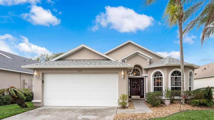 Welcome to this beautifully maintained, single-story home that perfectly blends comfort, style, and functionality. From the moment you arrive, the manicured front yard and inviting entry to set the tone for what’s inside. Step into a bright, open living space filled with natural light from large windows. The formal living and dining area offers the perfect setting for entertaining guests or enjoying quiet evenings at home.  The kitchen is updated and designed with both style and convenience in mind, featuring modern appliances, generous storage, and a breakfast bar ideal for casual meals. Just beyond, the spacious family room provides plenty of seating for gatherings, movie nights, or simply relaxing with friends and family. This home offers a desirable split floor plan with a primary suite, complete with an ensuite bathroom and a full-size soaking tub—perfect for unwinding at the end of the day. Two additional bedrooms share a well-appointed full bathroom, making it ideal for families or guests. Step outside to your own private back yard fully fenced yard features a covered, screened-in patio—perfect for enjoying Florida year-round. The home has a New Roof and A/C in 2023.