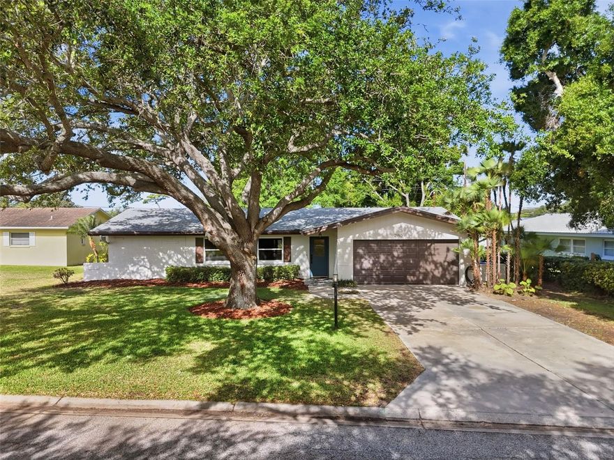 One or more photo(s) has been virtually staged. *Open House Sunday 12-2* Welcome to your dream home in the highly sought-after Fairway Estates! This 3-bedroom, 2-bath stunner has been meticulously renovated, featuring a modern open-concept floor plan designed for effortless living and entertaining. The chef-inspired kitchen boasts sparkling quartz countertops, a full custom backsplash, and a dramatic waterfall island that acts as the centerpiece of the home.
Enjoy the seamless flow of durable luxury vinyl flooring throughout the main areas, with elegant ceramic and porcelain tile in the updated baths. A smart split-floor plan offers maximum privacy, while the pass-through kitchen design connects perfectly to the living spaces. Outside, relax on your private back patio—the ultimate spot for entertaining friends or relaxing after a round of golf. Includes a 2-car garage. This turnkey beauty is ready for you!