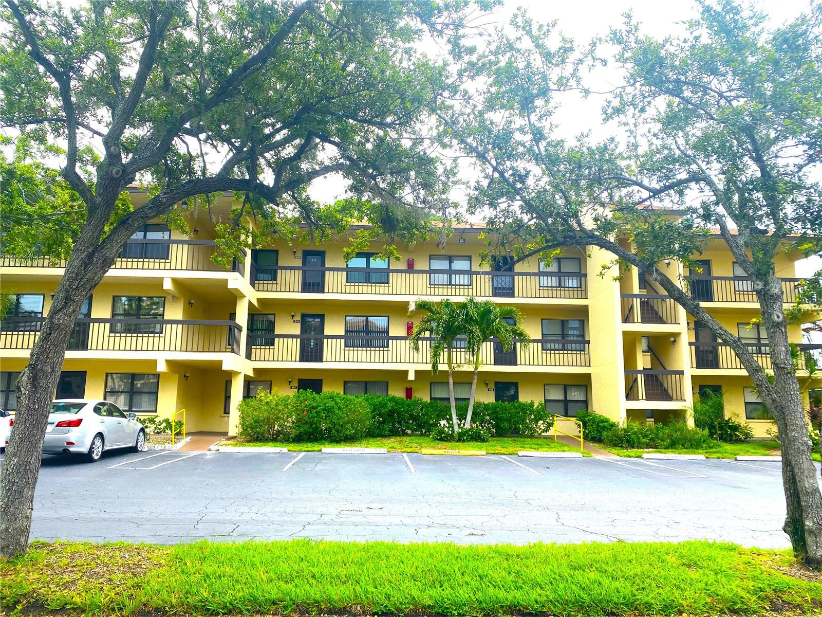 Welcome to Desoto Square Villas, a charming 55+ gated community offering peace, comfort, and a relaxed lifestyle. This spacious 2-bedroom, 2-bath condo—one of the largest in the community—features serene pond views and lush tropical landscaping, best enjoyed from the 72 sq ft covered lanai. Inside, the living area is warm and inviting with vinyl plank flooring throughout, complemented by added carpet in part of the living room for extra comfort.
The kitchen comes fully equipped and includes a breakfast bar and extended sitting area, flowing into a bright, flexible space perfect for dining or relaxing, with direct lanai access. Both bedrooms have walk-in closets for added functionality. The primary bathroom includes a walk-in shower, while the guest bath features a tub for soaking. A carport and extra storage unit add convenience.
Residents enjoy HOA fee that includes internet, cable Tv, water, sewer, trash and access to fantastic amenities: heated pool, tennis, pickleball, shuffleboard,exercise room clubhouse activities, and a welcoming grill areas. The location is ideal—just minutes from downtown Bradenton, Anna Maria Island, Robinson Preserve, top shopping, dining, medical facilities, and more. Come enjoy the best of Florida living!