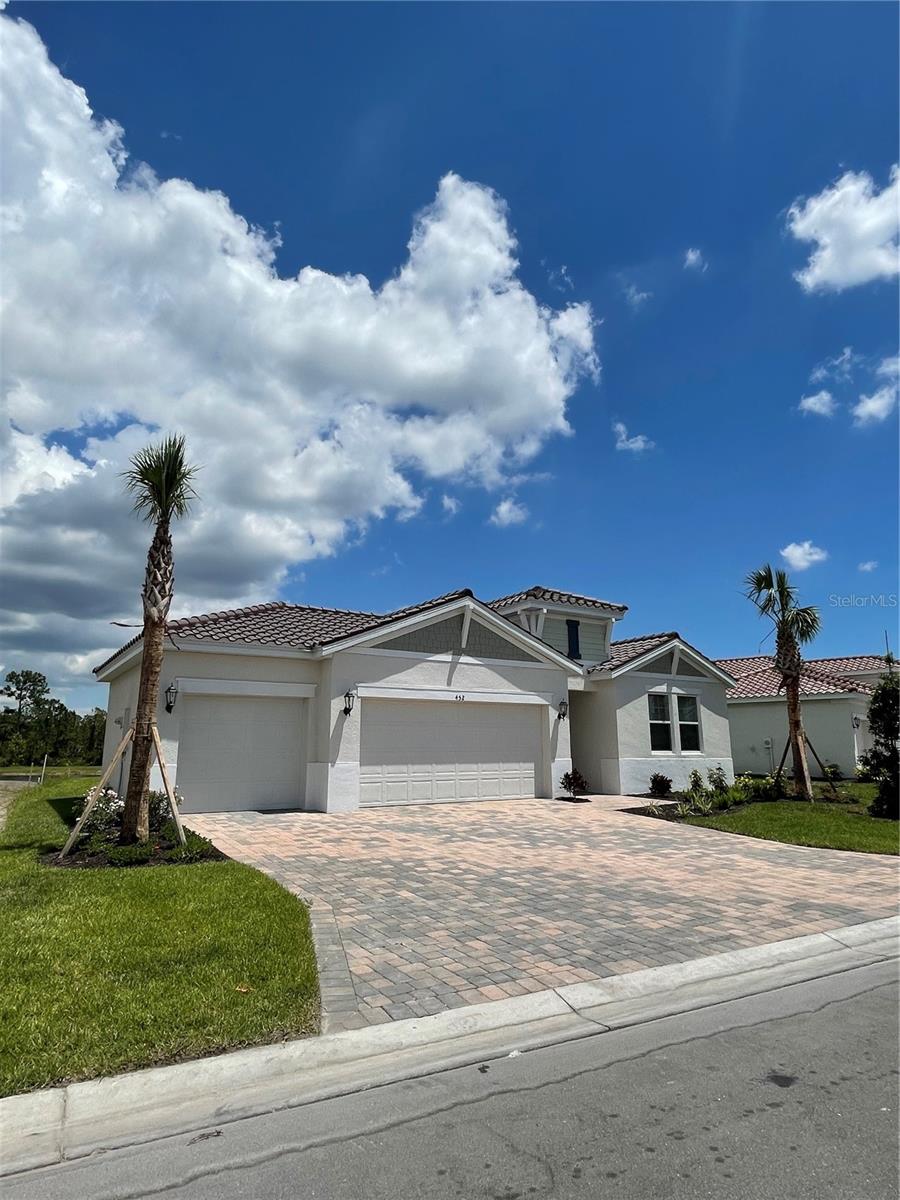 Major price reduction for a newer home with three car garage! Enjoy cooking in the chef-inspired kitchen while easily entertaining in the open great room and dining space. Calming Coastal, Gourmet Kitchen, Refrigerator, Washer Dryer, Pond Front. The back porch is covered with lanai providing you relaxing vibe when enjoying outdoor pond views. This gated Venice Woodlands community has beautifully manicured grounds surrounded by lakes and wooded preserve. Highly sought-after amenities will include a clubhouse, pickleball courts, fitness center, resort-style pool and bocce ball court. Enjoy easy access to I-75, downtown Sarasota and downtown Venice. Known for the energy-efficient features this home will help you live a healthier and quieter lifestyle while saving thousands on utility bills.