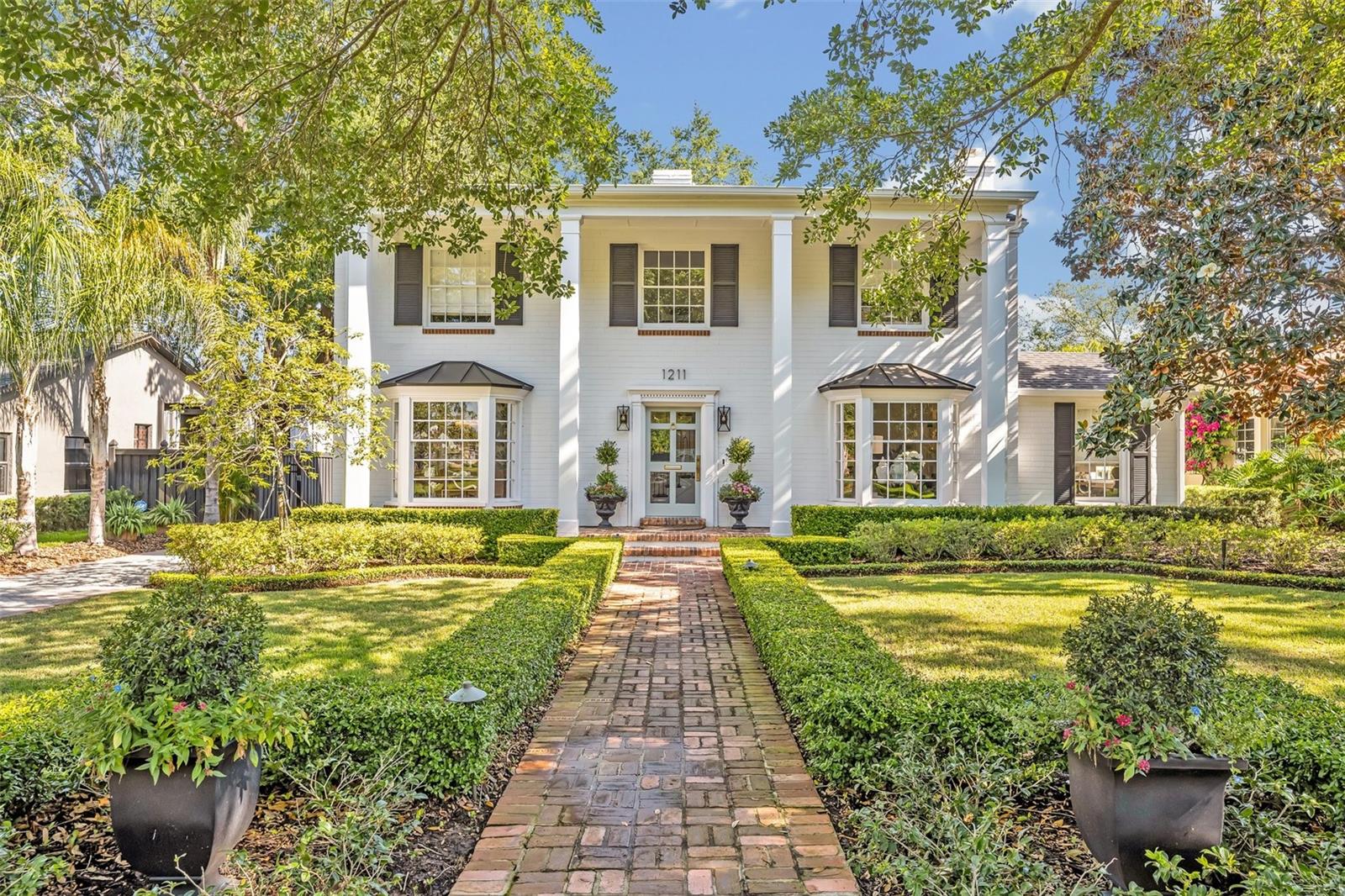 Exquisite, custom home for lease in Lake Adair community. Originally built in 1940, this designer home has been completely renovated and is available for rent, Fully Furnished. The inviting Foyer leads to spacious & well-defined Living Room, Dining Room, Office/Den, sitting room with built-in bar, and a powder room. You will be dazzled by the Beautiful designer furniture & finishes throughout this home. The spectacular kitchen boasts Quartz counter tops, separate freezer & refrigerator, gas range, 2 dishwashers, butler's pantry, wine fridge, and oversized island with seating for six. It overlooks a wonderful backyard space and has tons of natural light. Also on the first floor is the primary bedroom and bath. The primary bedroom boasts custom, built-in closets and a large bath with double sinks and double shower heads. The graceful staircase at the center of the home leads to 3 bedrooms upstairs, one with an en-suite bath, and the other two bedrooms share a guest bath. The fully fenced/gated backyard, is private so you can enjoy your days lounging on the covered porch, swimming in the saltwater pool and using the outdoor kitchen! There is a one-car garage with EV Charger for tenant use as well. Amazing location convenient to major Orlando arteries, Downtown Districts, College Park shopping and dining. Call for your private showing today.