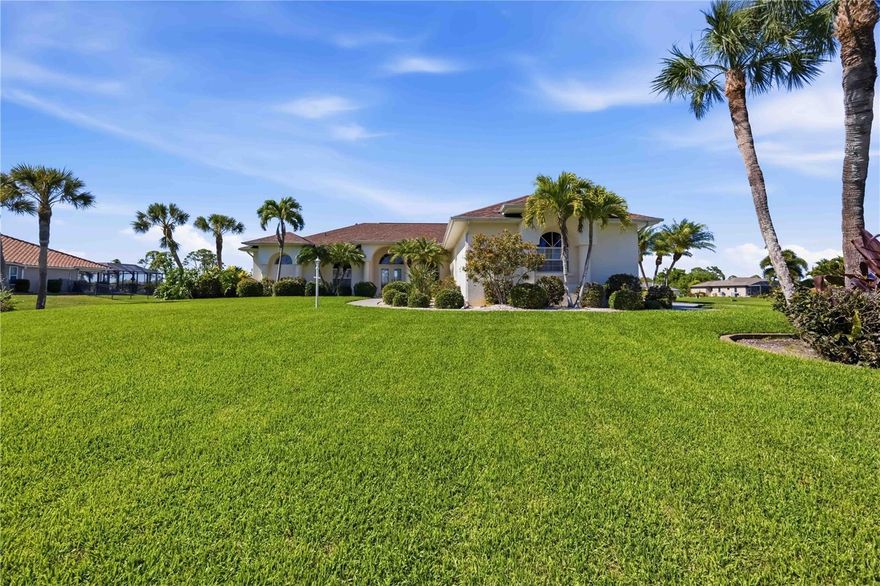 Turnkey furnished and stunning home seated on over half an acre with serene canal views located in the desirable deed restricted community of Rotonda West. This one-of-a-kind home boasts elegance both inside and out with luscious landscaping encompassing the entire home & well-manicured lawn that leads up to the arched front entry with columns and french doors leading inside. With a myriad of elegant architectural features including arched windows 12' high cathedral ceilings throughout the home and 14' coffered ceiling in the living room, stylish mouldings, 8' doorways and an abundance of natural light. This 3-bedroom + office, and a formal dining room or den, 2.5-bathroom, and OVERSIZED 3-car garage offers an open floor plan with a large eat-in kitchen area with wood cabinetry, quality appliances including a cooktop, range, & new refrigerator --plus under cabinet lighting, a breakfast bar and an aquarium window in the dinette area that overlooks the pool. The sizable family room with crown molding, a "wall" of windows (8' x 7') offering an unobstructed view of the stunning Rotonda River with triple pocketing 8' sliding glass doors allowing you to expand your living space outside to your private Florida oasis! This incredible outdoor living space includes a recently resurfaced pool and freshly painted lanai that you can enjoy year round with a heated pool and spa, and the convenience of an outdoor pool bath and a storage closet--all of this plus a tranquil water view. Back inside, the primary suite is spacious with a tray ceiling, double 8' sliding glass doors that lead to the lanai & a spa-like ensuite bath with dual sinks, a make-up vanity space, private water closet, and a linen closet. On the opposite side of the home are the two guest rooms--both with carpeting, roomy closets, ceiling fans and the spacious guest bath that offers a linen closet, large tiled shower, and lots of counter and cabinet space. The extra-large laundry room offers all the storage you could want with ample cabinets, additional counter space, and a storage closet, with the added bonus of a sink and access to the garage. Additional upgrades include a whole house water softener installed in 2025, the 2017 HVAC has 3 zones, all the carpeting was replaced in 2023, roof (2022), pool cage (2023), and a canal-fed irrigation system. Don’t wait, come live the Florida dream! Enjoy the five golf courses Rotonda West offers along with walking trails, pickleball courts and freshwater canals for kayaking all just minutes away. Conveniently located near shopping, restaurants, beaches, fishing, local farmers markets and so much more. Make this home your dream come true.