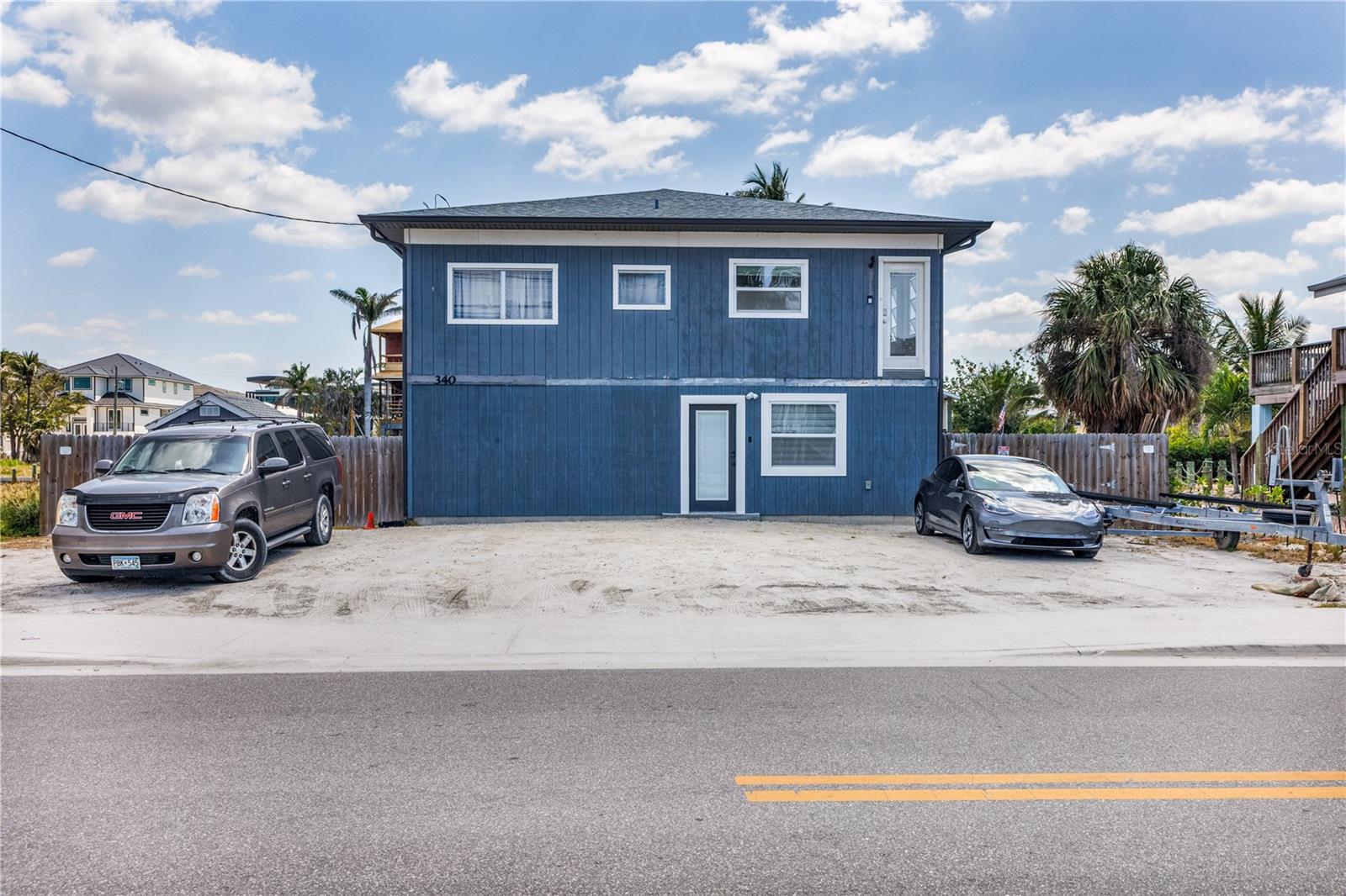 GREAT OPPORTUNITY to own property in the Time Square Area of Fort Myers Beach! Lot is zoned commercial for 10 units and below! This Duplex offers a 2 bedroom 1 bathroom upstairs and a 1 bedroom 2 bath downstairs. This lot has 70 FEET of Frontage, dock, fish cleaning station, boat lift, large grass backyard (with irrigation) & 2 patios facing the water. Just steps away from the BEACH, DINING, SHOPPING & ENTERTAINMENT! You cannot get any closer to the hustle & bustle Fort Myers Beach! Whether you're an investor, looking for your own vacation cottage, looking to build something more to suit your needs, or even a bed & breakfast this property has it! Seller Financing is available.