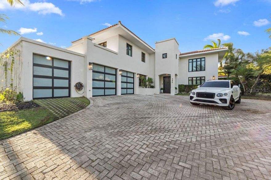 This Dorado Beach East residence offers 5,813 interior sq ft with high-end finishes throughout. The 5-bedroom, 5.5-bath layout includes designer wallpapers, curated furnishings, and high ceilings. The open dining and living areas extend into an enclosed terrace with floor-to-ceiling glass, a custom bar with ice maker and wine fridge, and a billiard table.
The kitchen features high-end Café appliances, a walk-in pantry with a second refrigerator, and a wine cellar. A guest bedroom with an en-suite bathroom completes the first floor.

Upstairs, the primary suite includes an expanded walk-in closet with LED lighting and a designer-accented wall. Three additional bedrooms, each with their own en-suite bathrooms, provide comfort and privacy.
Outdoors, enjoy a pool, outdoor kitchen, and multiple lounge areas on a 0.35-acre corner lot. Located at the end of a cul-de-sac and close to Orlando Health Hospital, TASIS Dorado, and local dining.

Turnkey and move-in ready, schedule your private showing today.