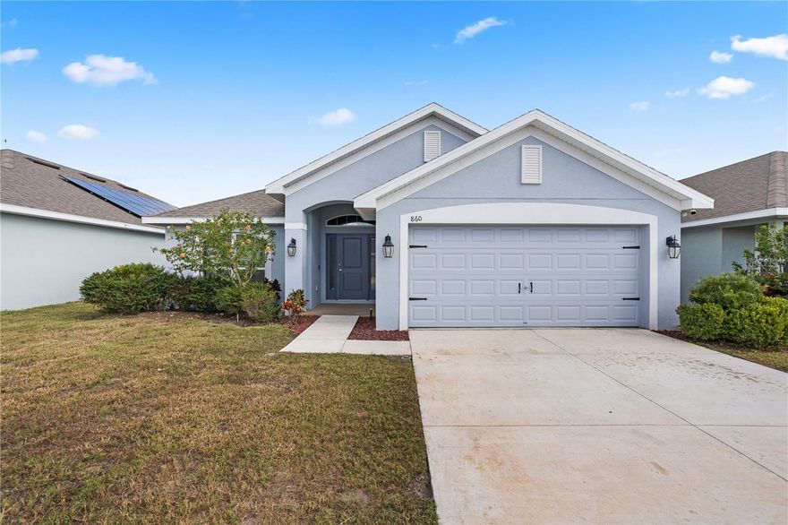 Welcome to your beautifully maintained 4-bed, 2-bath home in the desirable Villamar community of Winter Haven! This 2021-built residence features an inviting open floorplan with high ceilings and all-tile flooring throughout the main living areas. Enjoy a spacious kitchen with a breakfast nook, large living and dining areas perfect for everyday living and entertaining, and a thoughtfully designed split bedroom layout for added privacy. The generous primary suite offers double sinks, a garden tub, and a separate shower. Built with energy efficiency in mind, this home includes a 15 SEER A/C, double-pane windows, quality shingles, and R38 insulation. Step outside to your covered lanai and fenced backyard — ideal for outdoor gatherings or relaxing in the Florida sunshine. Community amenities include a clubhouse, pool, and park within walking distance. Don’t miss out on this perfect blend of comfort, style, and convenient location!