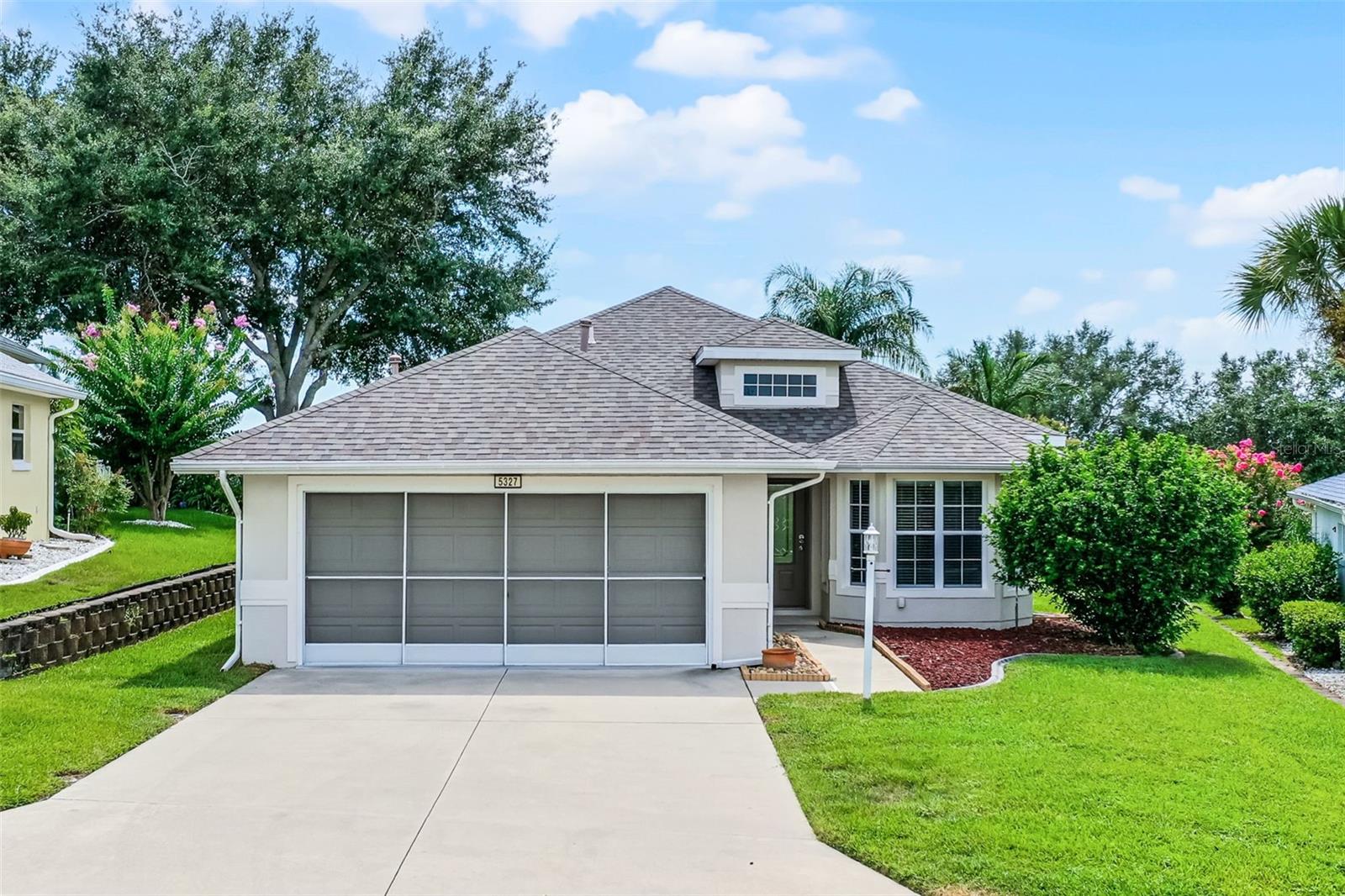 This beautifully maintained 3-bedroom, 2-bath split floor plan home located in the sought-after Royal Harbor 55+ community on the shores of The Harris Chain of Lakes. AC 2025 and Roof 2019 and Hot water heater 2025. This block home offers excellent curb appeal and the added privacy of no rear neighbors. Step through the elegant lead glass front door into a welcoming foyer with 12-foot ceilings and ceramic tile flooring. The upgraded kitchen features granite countertops, a cozy breakfast nook with bay windows, closet pantry, and ample cabinet and counter space. The breakfast bar opens to a spacious living and dining area with wood-style laminate flooring, perfect for entertaining. The primary suite is located at the rear of the home and includes tray ceilings, two walk-in closets, and sliding doors that lead to a covered, screened porch with partial windows. The updated en-suite bath boasts granite countertops, dual sinks, a walk-in tiled shower, and ceramic tile flooring. Two additional bedrooms share a full bath with granite vanity and a tub/shower combo. Royal Harbor is a vibrant, amenity-rich community offering pickleball, tennis, fishing pier, RV/boat storage, an indoor clubhouse, and an outdoor screened-in pool and spa with stunning views. Located close to shopping, restaurants, and Hickory Point boat ramp is just across from the subdivision. Enjoy nearby golf at the renowned Mission Inn Resort. Schedule your showing today, this home is a must-see and won't disappoint!
