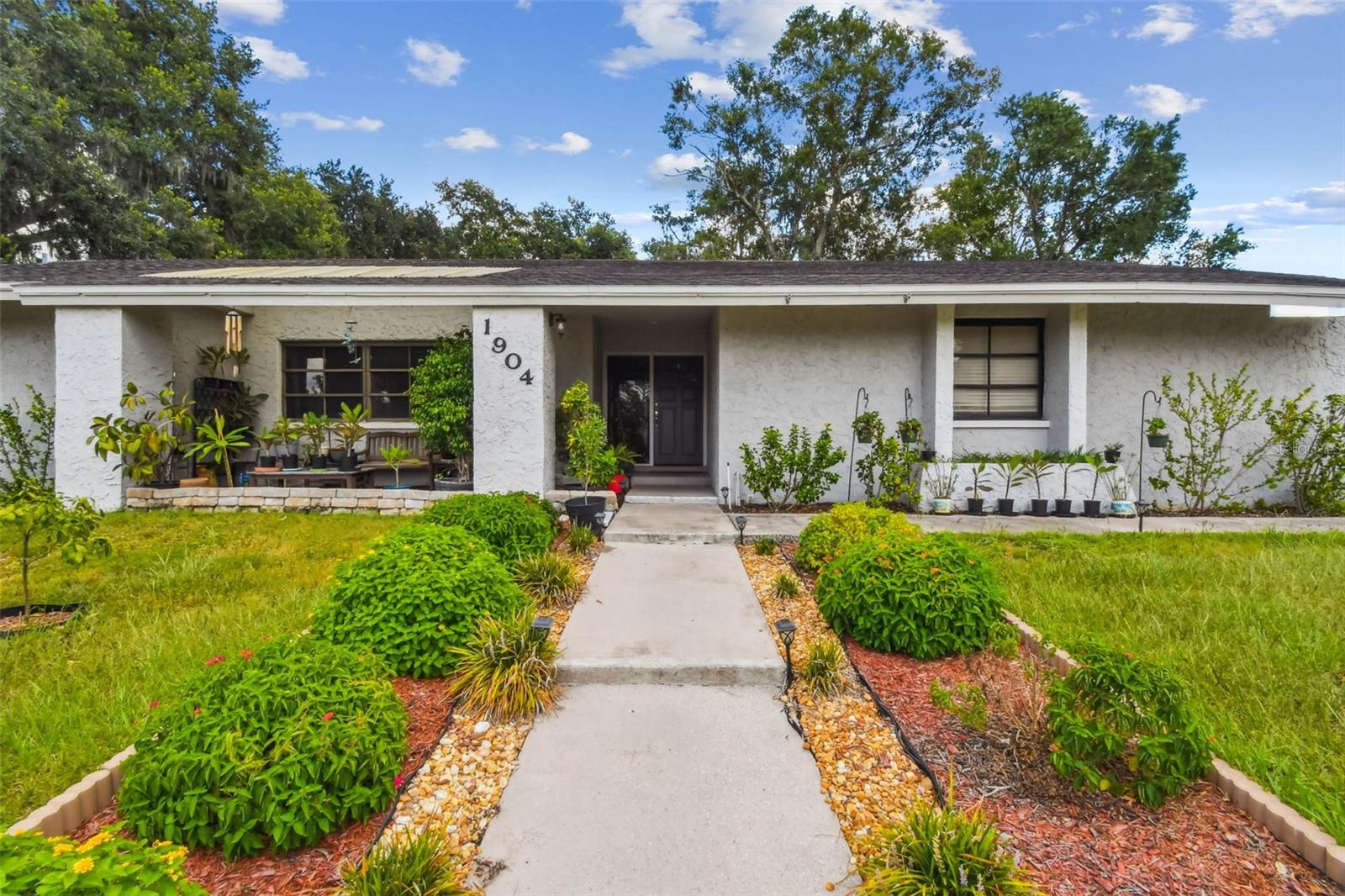 This charming 3-bedroom, 2-bathroom gem is nestled in the Walden Lake East community of Plant City. With approximately 1,934 sq?ft of living space on a generous 0.38-acre corner lot, this single-story residence offers both comfort and convenience.Split floor plan ensures privacy and smooth flow between communal and private spaces. A tranquil in-ground pool with screen enclosure invites year-round enjoyment. Walden Lake East is a serene, park-like neighborhood equipped with a clubhouse, playground, tennis and basketball courts, and community pool.