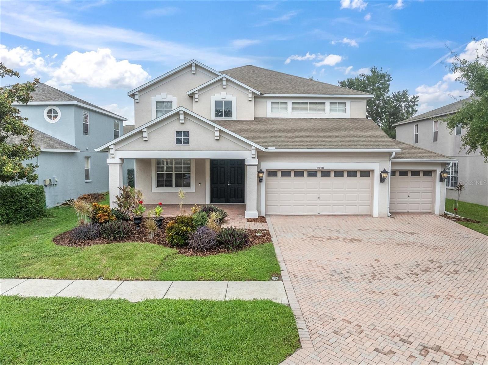 Discover your dream home in this elegant two-story residence, nestled in a small, peaceful community of Boyette Oaks. This home offers the perfect blend of luxury and comfort. Boasting a 3-car garage and a beautiful paver driveway, this home invites you in with a welcoming front porch, an ideal spot to sip your morning coffee. Step inside to soaring high ceilings that create an open atmosphere. The entire interior has been FRESHLY PAINTED THROUGHOUT with a warm, neutral beige. Stunning ceramic tile flooring with the elegant look of hardwood. The main level features an open floor plan with formal living and dining area, perfect for entertaining guests, alongside a cozy family room that overlooks the expansive screened lanai. To enjoy the fantastic, 600 square feet lanai, you can simply open up the triple sliding glass pocket door, making it perfect for entertaining with lots of room for seating, BBQ and even a hot tub- it's your own private oasis with so much space. The landscaped backyard is fully fenced with lots of room for the kiddo's & doggies to play. As you head back inside, the heart of the home is the amazing gourmet kitchen, equipped with stainless steel appliances, NEW side by side refrigerator, a cooking island, granite countertops, real wood cabinetry, walk-in pantry, breakfast bar and a dinette nook for those casual meals. A handy half bath is located downstairs, giving easy access for your guests and perfect access to the back patio as well. There's also a generous sized laundry room with storage cabinets, front-loading washer & dryer plus a laundry tub. As we venture upstairs, you'll find a versatile bonus room, giving you space for a home office, game room, home gym or a cozy lounge area-so many possibilities. The bonus room also gives you access to the covered 2nd story terrace that overlooks the pretty backyard. Your grand master suite awaits, tucked away down a few steps for added privacy, this expansive bedroom & master bath together offers you a private oasis of your own. With his/her vanities, his/her walk-in closets, separate walk-in shower & relaxing garden tub you'll feel like you're at a private spa. The secondary bedrooms will not disappoint, one with a walk-in closet and a nice size bathroom in between them with lots of counter space. If all of this isn't enough, the big-ticket items are taken care of for your peace of mind; THE NEW ROOF is scheduled to be done in September and comes with a 10-year labor warranty included for the new buyer! The new AC was installed in 2020. Some additional features include, ceiling fans, even on the porch & screened lanai, easy to maintain ceramic tile throughout the downstairs, lots of storage closets, Ring doorbell & home security system. It's such a rare find to have three separate outdoor spaces, be prepared to fall in love! And the three-car garage has so much room for your cars & lots of extra storage or even a workshop area. Boyette Oaks is a well-maintained community with low HOA fee of $350 twice a year, sidewalks for nice evening strolls & pet areas for the fur babies. Convenient location with easy access to I-75, close to some of the best shopping & dining in the area and within walking distance to the Boyette Family Farmers Market for your fresh fruits & vegetables, local honey & homemade treats. This gorgeous home has so much to offer- it won't last long, give me a call for your private showing today.