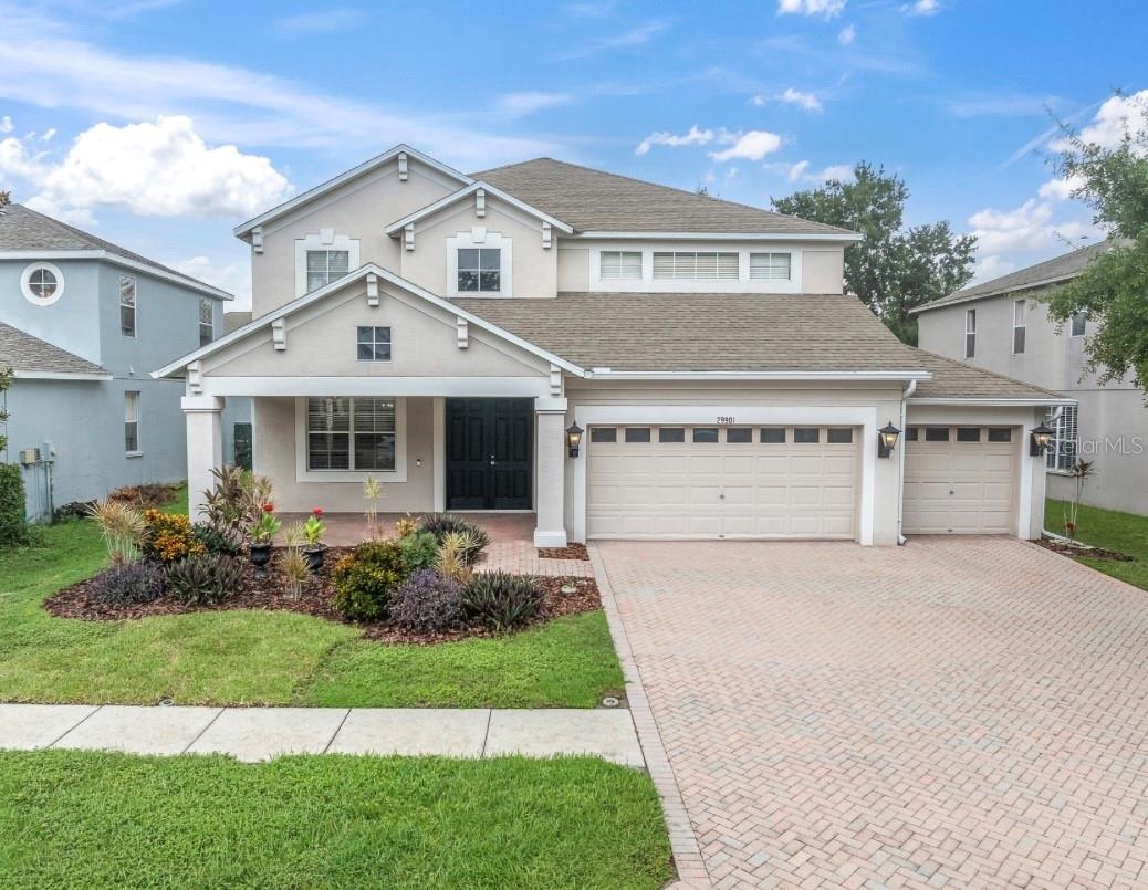Discover your dream home in this elegant two-story residence, nestled in a small, peaceful community of Boyette Oaks. This home offers the perfect blend of luxury and comfort. Boasting a 3-car garage and a beautiful paver driveway, this home invites you in with a welcoming front porch, an ideal spot to sip your morning coffee. Step inside to soaring high ceilings that create an open atmosphere. The entire interior has been FRESHLY PAINTED THROUGHOUT with a warm, neutral beige. Stunning ceramic tile flooring with the elegant look of hardwood. The main level features an open floor plan with formal living and dining area, perfect for entertaining guests, alongside a cozy family room that overlooks the expansive screened lanai. To enjoy the fantastic, 600 square feet lanai, you can simply open up the triple sliding glass pocket door, making it perfect for entertaining with lots of room for seating, BBQ and even a hot tub- it's your own private oasis with so much space. The landscaped backyard is fully fenced with lots of room for the kiddo's & doggies to play. As you head back inside, the heart of the home is the amazing gourmet kitchen, equipped with stainless steel appliances, NEW side by side refrigerator, a cooking island, granite countertops, real wood cabinetry, walk-in pantry, breakfast bar and a dinette nook for those casual meals. A handy half bath is located downstairs, giving easy access for your guests and perfect access to the back patio as well. There's also a generous sized laundry room with storage cabinets, front-loading washer & dryer plus a laundry tub. As we venture upstairs, you'll find a versatile bonus room, giving you space for a home office, game room, home gym or a cozy lounge area-so many possibilities. The bonus room also gives you access to the covered 2nd story terrace that overlooks the pretty backyard. Your grand master suite awaits, tucked away down a few steps for added privacy, this expansive bedroom & master bath together offers you a private oasis of your own. With his/her vanities, his/her walk-in closets, separate walk-in shower & relaxing garden tub you'll feel like you're at a private spa. The secondary bedrooms will not disappoint, one with a walk-in closet and a nice size bathroom in between them with lots of counter space. If all of this isn't enough, the big-ticket items are taken care of for your peace of mind; THE NEW ROOF is scheduled to be done in September and comes with a 10-year labor warranty included for the new buyer! The new AC was installed in 2020. Some additional features include, ceiling fans, even on the porch & screened lanai, easy to maintain ceramic tile throughout the downstairs, lots of storage closets, Ring doorbell & home security system. It's such a rare find to have three separate outdoor spaces, be prepared to fall in love! And the three-car garage has so much room for your cars & lots of extra storage or even a workshop area. Boyette Oaks is a well-maintained community with low HOA fee of $350 twice a year, sidewalks for nice evening strolls & pet areas for the fur babies. Convenient location with easy access to I-75, close to some of the best shopping & dining in the area and within walking distance to the Boyette Family Farmers Market for your fresh fruits & vegetables, local honey & homemade treats. This gorgeous home has so much to offer- it won't last long, give me a call for your private showing today.