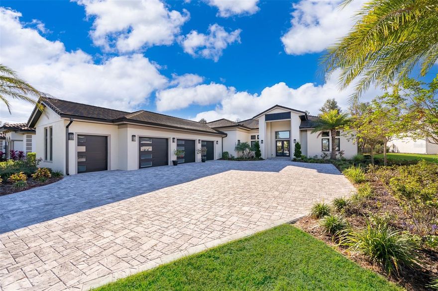 Experience refined luxury living in this stunning contemporary custom residence located within the well-know  gated community of Bella Collina. Professionally and impeccably designed, this move-in ready home blends sophistication, comfort, and functionality with thoughtfully curated upgrades throughout. Flooded with natural light, the expansive open-concept floorplan showcases soaring ceilings, oversized porcelain tile flooring, and impressive 10-foot sliding glass doors that seamlessly connect indoor and outdoor living spaces.

The gourmet chef’s kitchen is beautifully appointed with sleek custom cabinetry and premium Thermador appliances, including a 48-inch six-burner gas range, double wall ovens, and a built-in microwave, creating the perfect space for both everyday living and entertaining. The luxurious primary suite offers tranquil views of the private, forest-like backyard and features a fully upgraded spa-inspired bath complete with an oversized walk-in shower, dual vanities, a freestanding soaking tub, and elegant custom wall detailing.

Designed for entertaining, the spacious family/game room opens through double pocket sliding doors to an oversized covered lanai featuring a custom outdoor kitchen and resort-style pool—an ideal setting for gathering with family and friends. The 3.5-car garage provides generous storage and convenient golf cart parking.

Additional enhancements include professional landscape lighting, an expansive paver driveway, and water softener system, and a whole-home lightning surge protector installed in 2025 for added comfort and peace of mind.

Residents enjoy access to Bella Collina’s exceptional amenities, including the Nick Faldo-designed 18-hole championship golf course, Har-Tru tennis courts, pickleball courts, resort-style pool complex, fitness center, luxury spa, complimentary fitness classes, and year-round social and culinary events.

Discover elevated living in one of Central Florida’s premier private golf communities—schedule your private showing today.