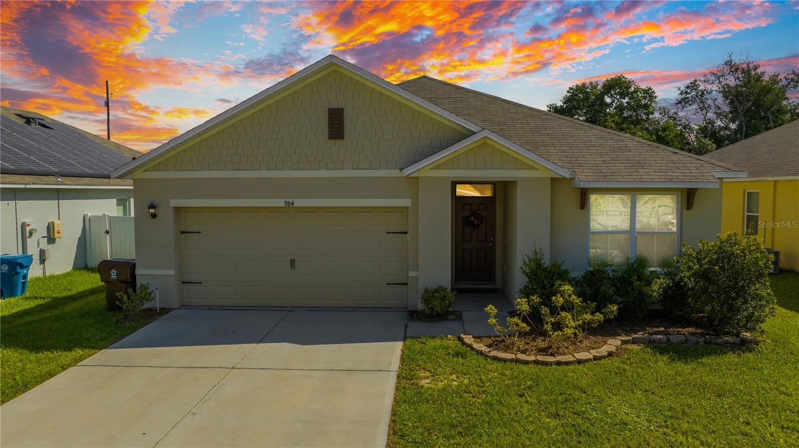 Welcome to your new home at 984 Chnaler Dr, Haines City, FL, a charming 3-bedroom, 2-bathroom single-family residence that blends comfort and convenience in a serene neighborhood. This inviting home features a spacious open floor plan with a modern kitchen boasting stainless steel appliances and a breakfast bar, a primary suite with an en-suite bathroom and walk-in closet, and a open backyard perfect for relaxation or outdoor activities. With an attached two-car garage, in-unit laundry, and central air conditioning, this home is designed for modern living. Located just minutes from schools, shopping, dining, and major highways for easy commutes to Orlando or Tampa, it’s ideal for families or professionals seeking small-town charm with access to attractions like LEGOLAND Florida.