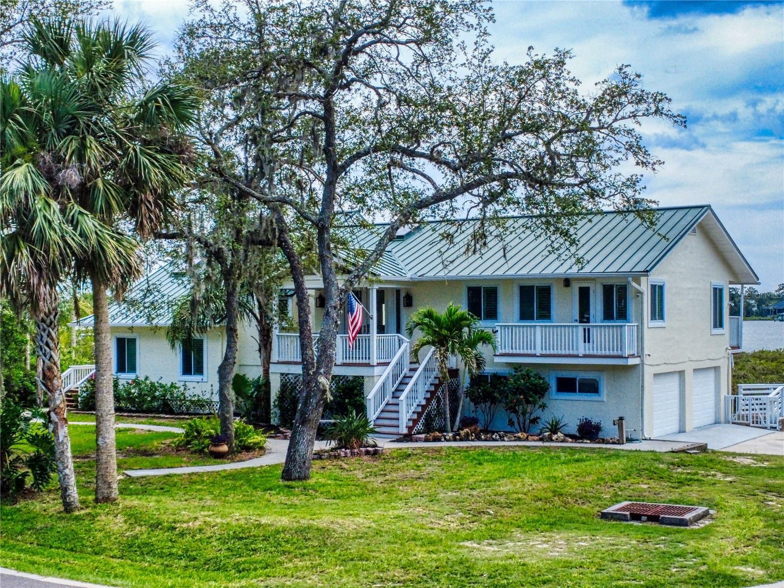Price Reduction! Experience elegant waterfront living on the stunning Turnbull Bay Estuary a fisherman’s paradise! Fish the peaceful backwaters or take your boat from your private dock, complete with lift, water, and electric, directly to Intracoastal. And enjoy the gorgeous sunsets. This beautifully remodeled home features two spacious master suites, two inviting living rooms, and two fireplaces. Enjoy breathtaking water views from the luxurious master suite. Multiple decks provide ample space for outdoor entertaining and soaking in the coastal views. Inside, oak laminate floors flow throughout, with tile in the bathrooms. The upgraded kitchen includes a built-in microwave, electric range, perfect for hosting. A dumbwaiter conveniently connects the main floor to a downstairs man cave with a custom bar. Additional highlights include new garage doors and Easy Dam flood doors for added protection. Coastal Florida living at its best.