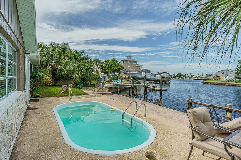 Photo of 6613 Harbor Drive, Hudson, FL 34667 (MLS # TB8425052)