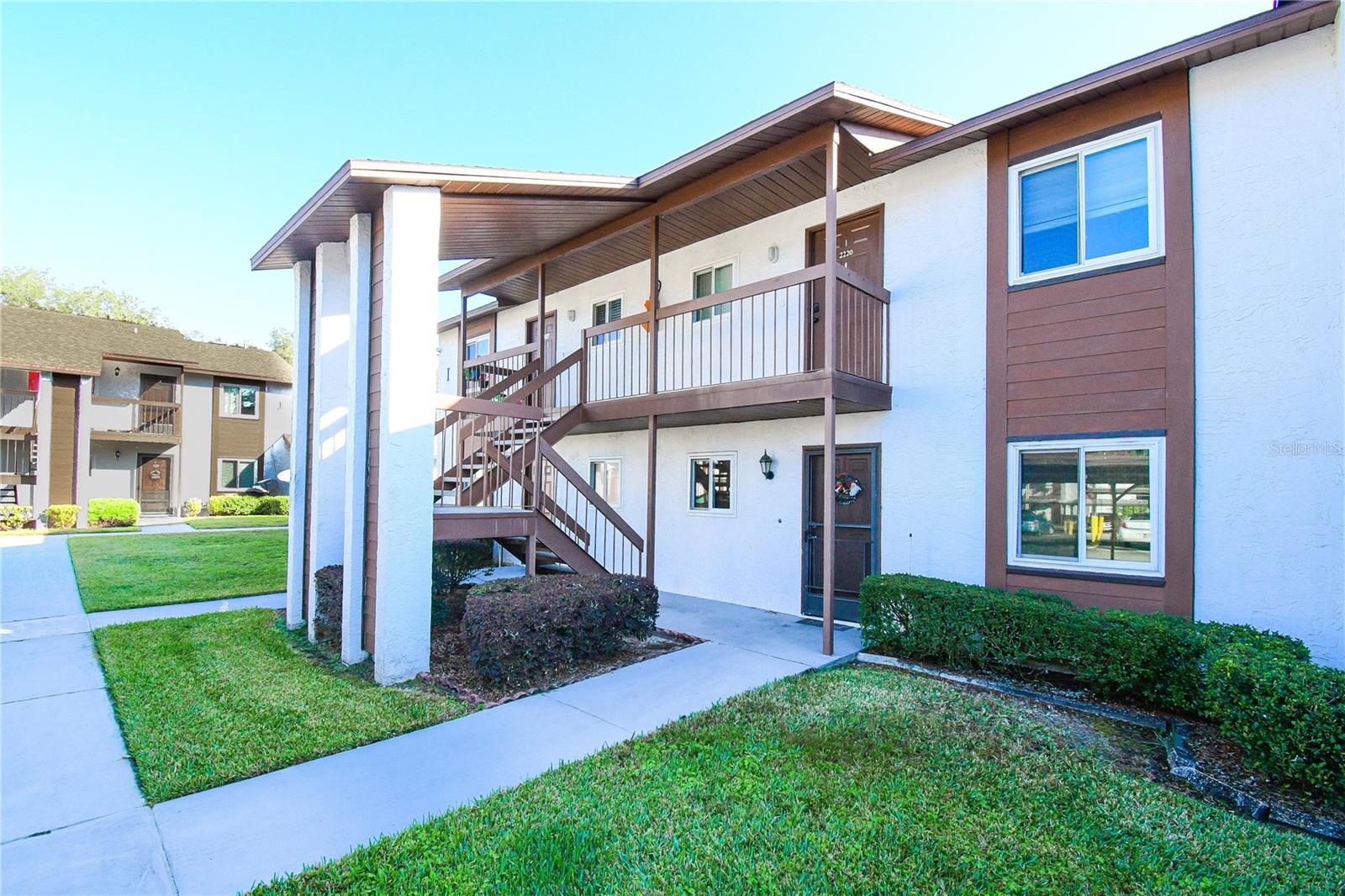Centrally Located 2-Bedroom, 2-Bathroom Zephyrhills Condo – Investment Opportunity- You can generate $1500 a month in rental income, making it an ideal option for investors seeking a turnkey property.Discover maintenance-free living or an excellent investment opportunity with this charming second-floor condominium. Featuring an open floor plan, this 2-bedroom, 2-bathroom unit includes luxury vinyl flooring, an in-unit stackable washer/dryer, and a screened lanai/balcony overlooking a peaceful pond.With a low HOA fee of just $275/month (NO CDD!), enjoy services such as building exterior maintenance, landscaping, trash removal, and access to the pool, clubhouse, playground, and car wash station. The fee also includes one assigned covered parking spot and ample visitor parking.Conveniently located close to shopping, dining, hospitals, and offering an easy commute to Wesley Chapel and Dade City, this condo combines comfort, convenience, and cash flow potential. Move-in ready and attractively priced to sell quickly!